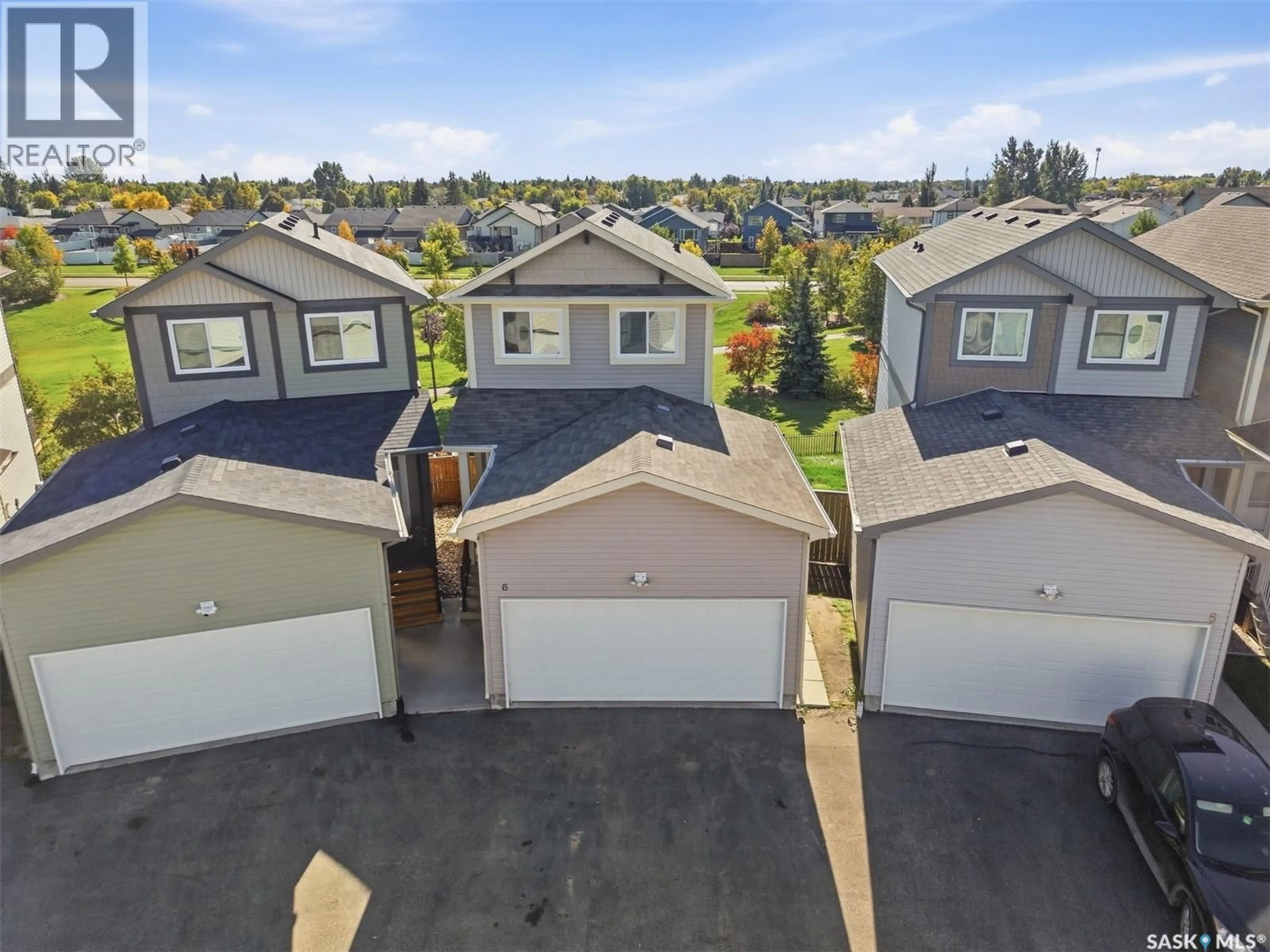 A pic from outside/outdoor area/front of a property/back of a property/a pic from drone, unknown for 202 - 6 MCKAGUE CRESCENT, Saskatoon Saskatchewan S7R0L8