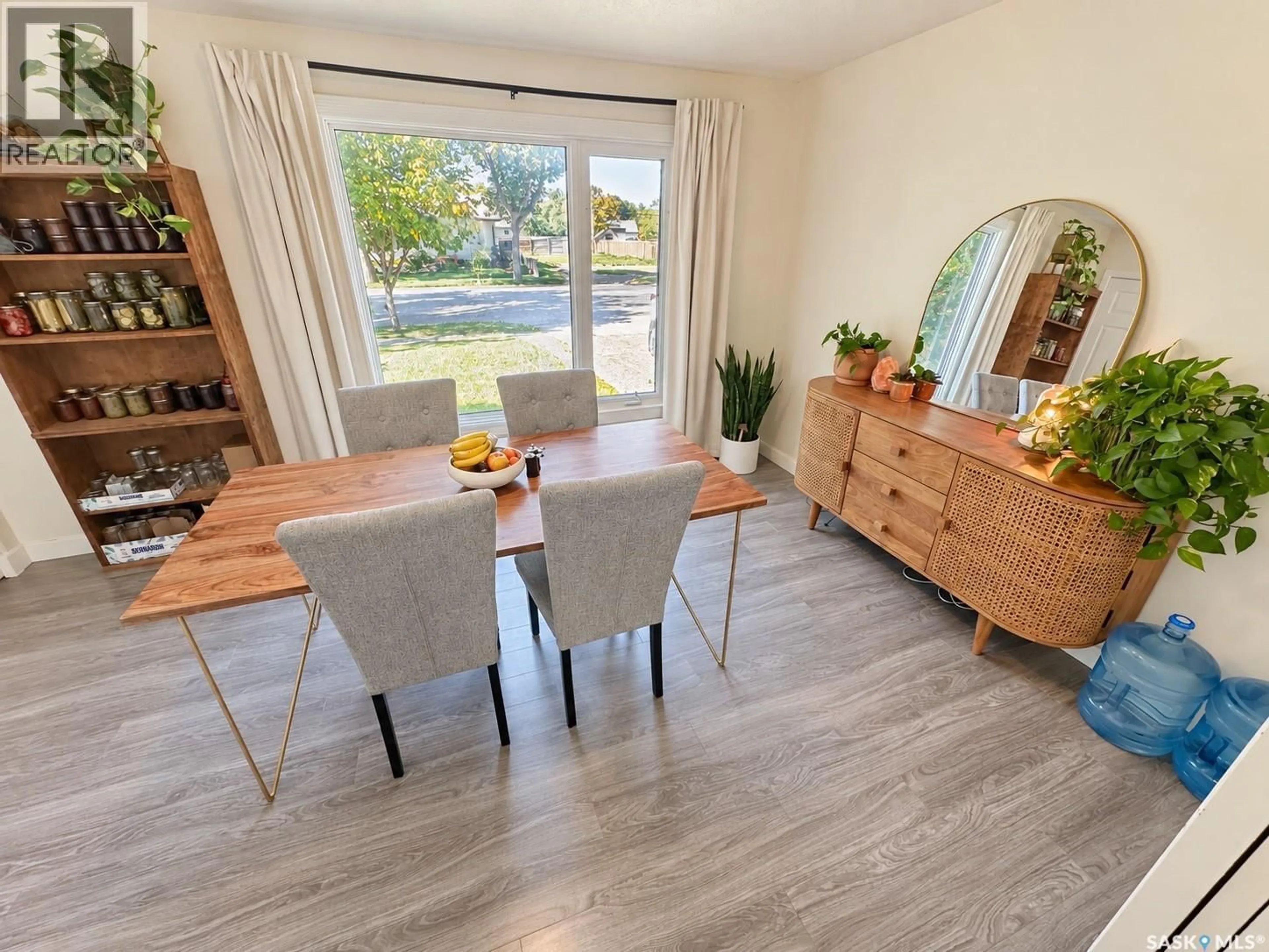 Dining room, wood/laminate floor for 230 10TH STREET, Weyburn Saskatchewan S4H2W3