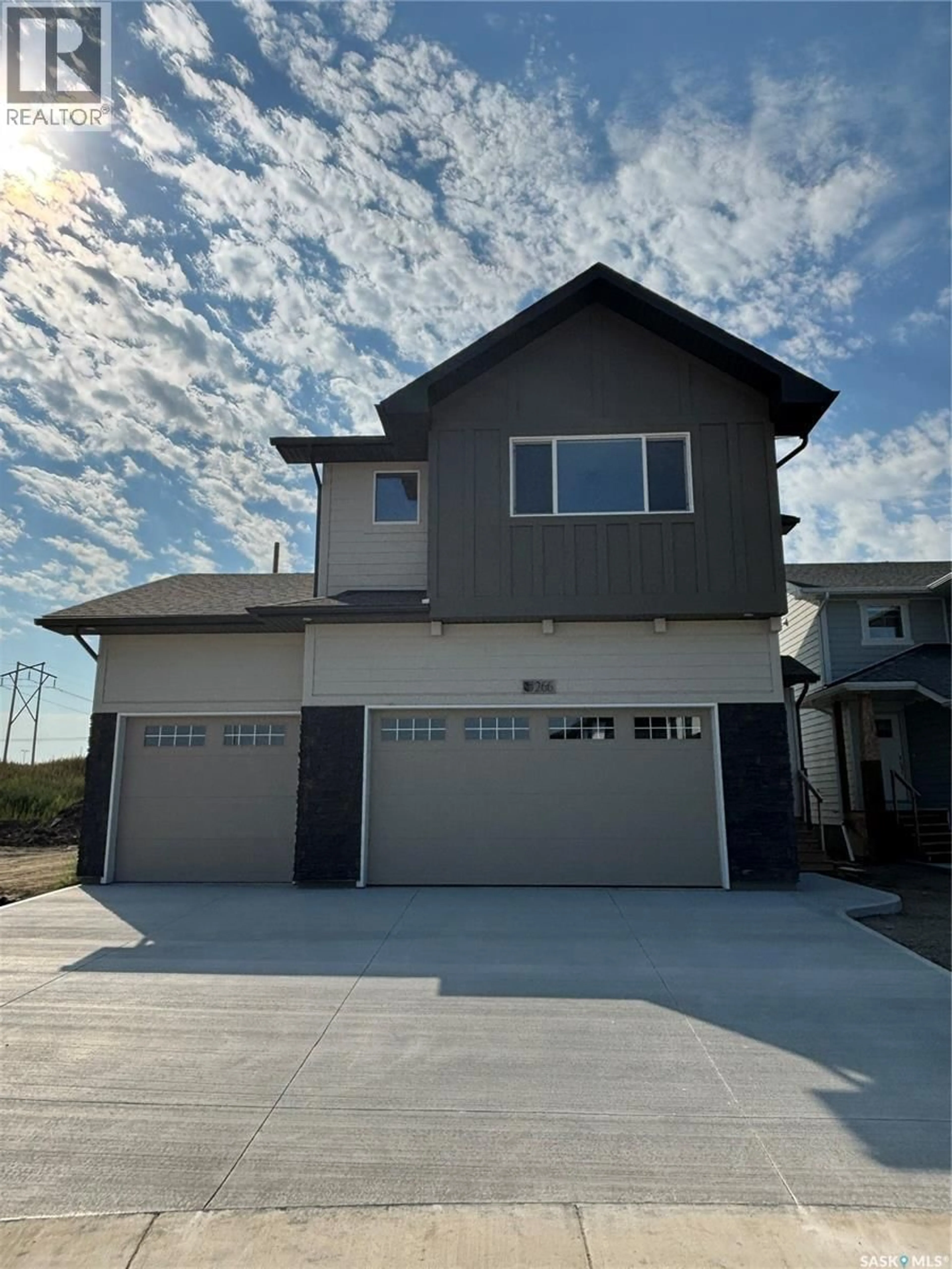 Home with vinyl exterior material, street for 266 KOSTIUK CRESCENT, Saskatoon Saskatchewan S7V2A3