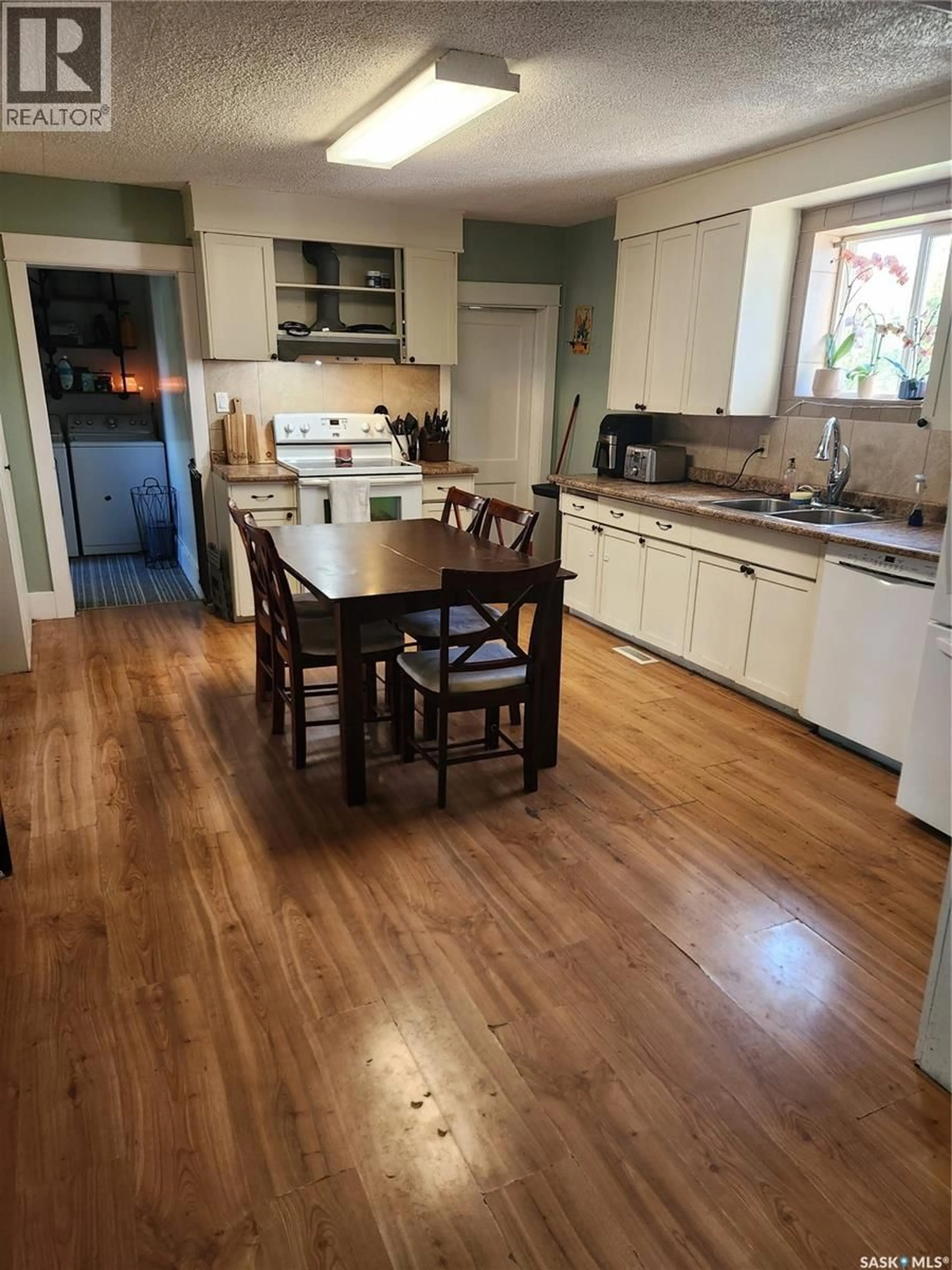 Open concept kitchen, wood/laminate floor for 748 MARKET STREET, Bethune Saskatchewan S0G0H0