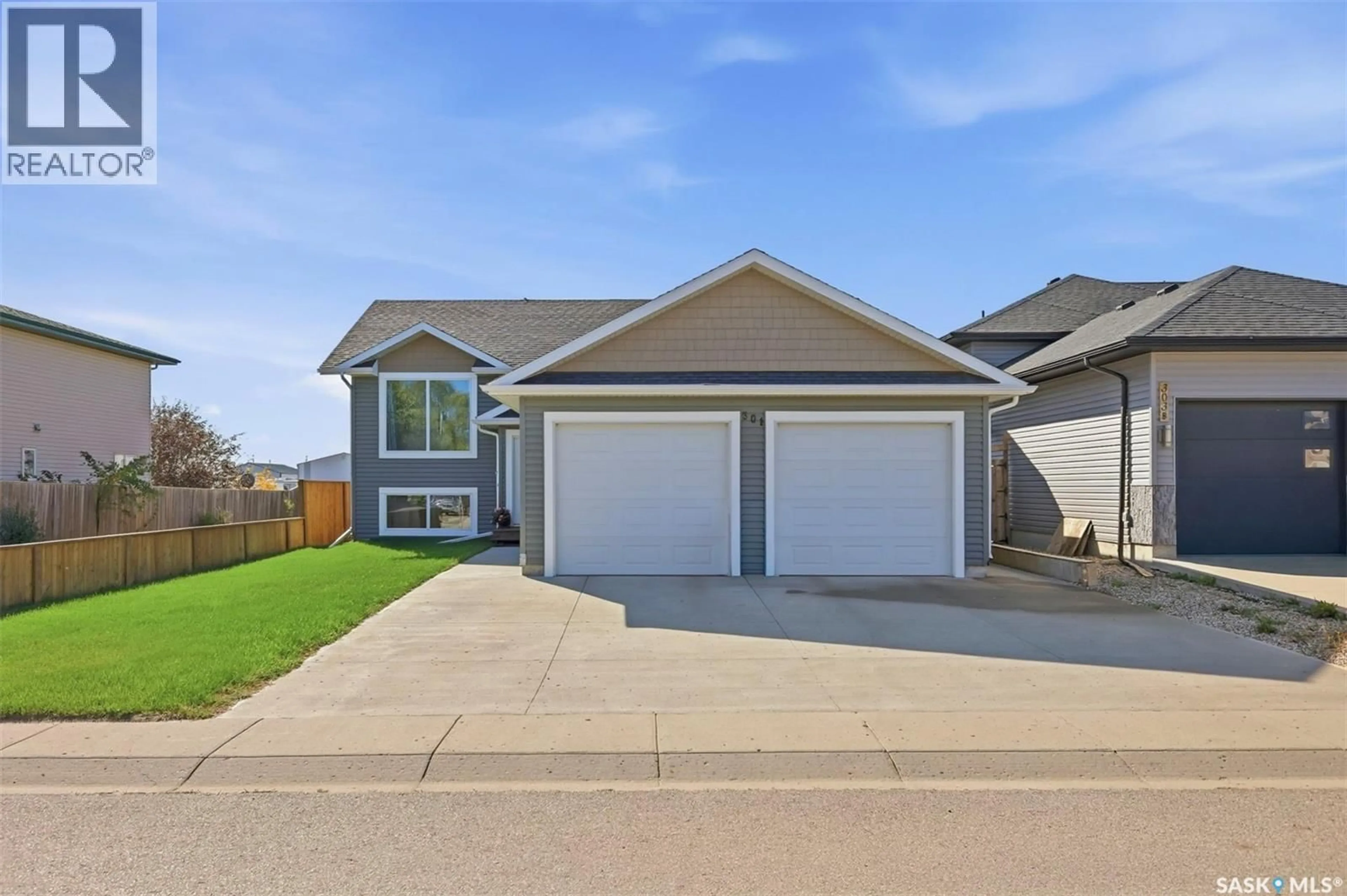 Home with vinyl exterior material, street for 301 HAICHERT STREET, Warman Saskatchewan S0K4S0