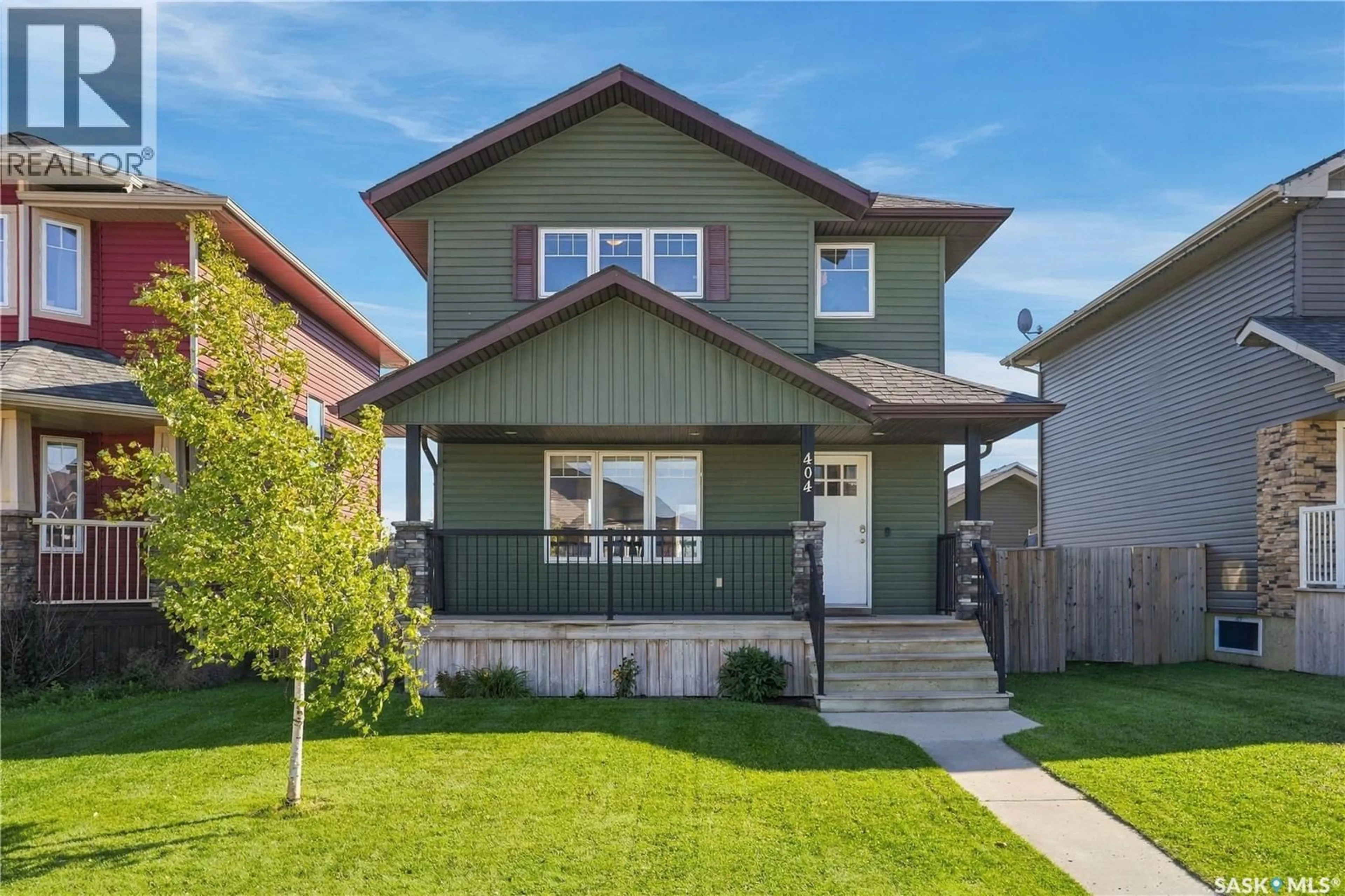 Home with brick exterior material, street for 404 REDWOOD CRESCENT, Warman Saskatchewan S0K4S2