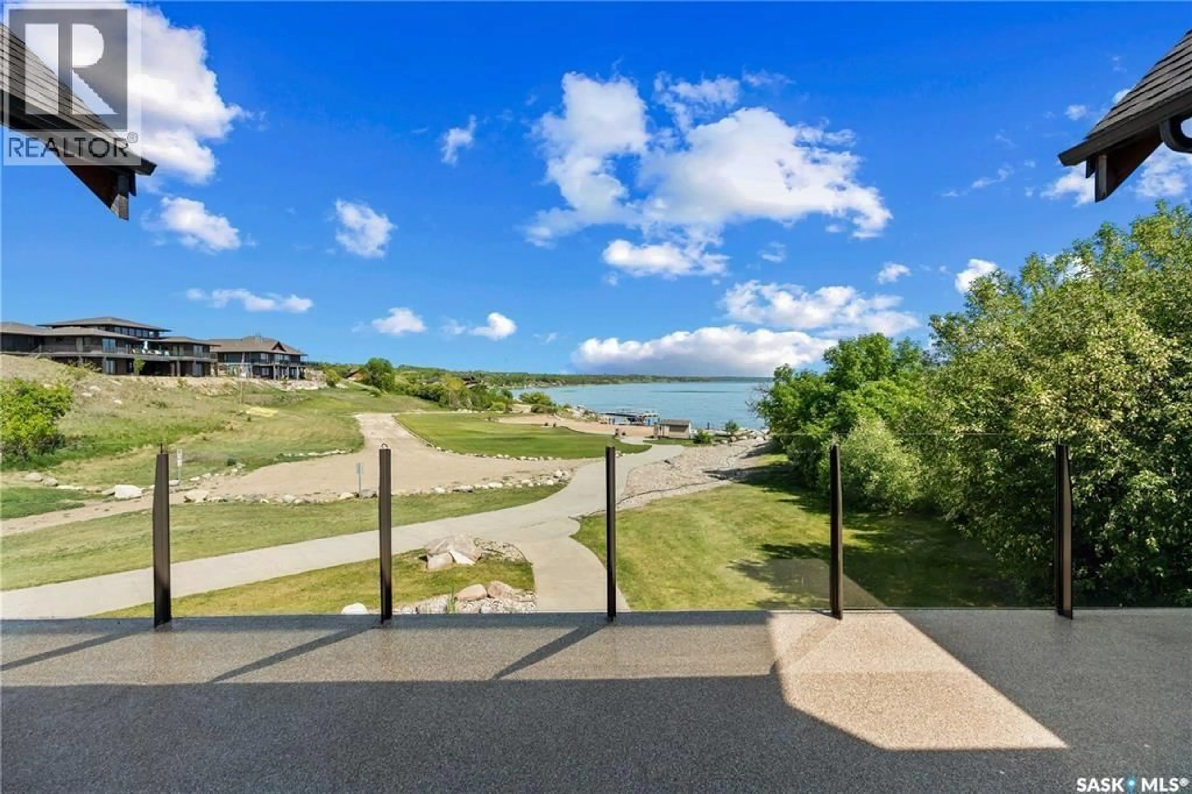 A pic from outside/outdoor area/front of a property/back of a property/a pic from drone, water/lake/river/ocean view for 44 MIHR WAY, Last Mountain Lake Saskatchewan S0G4L0