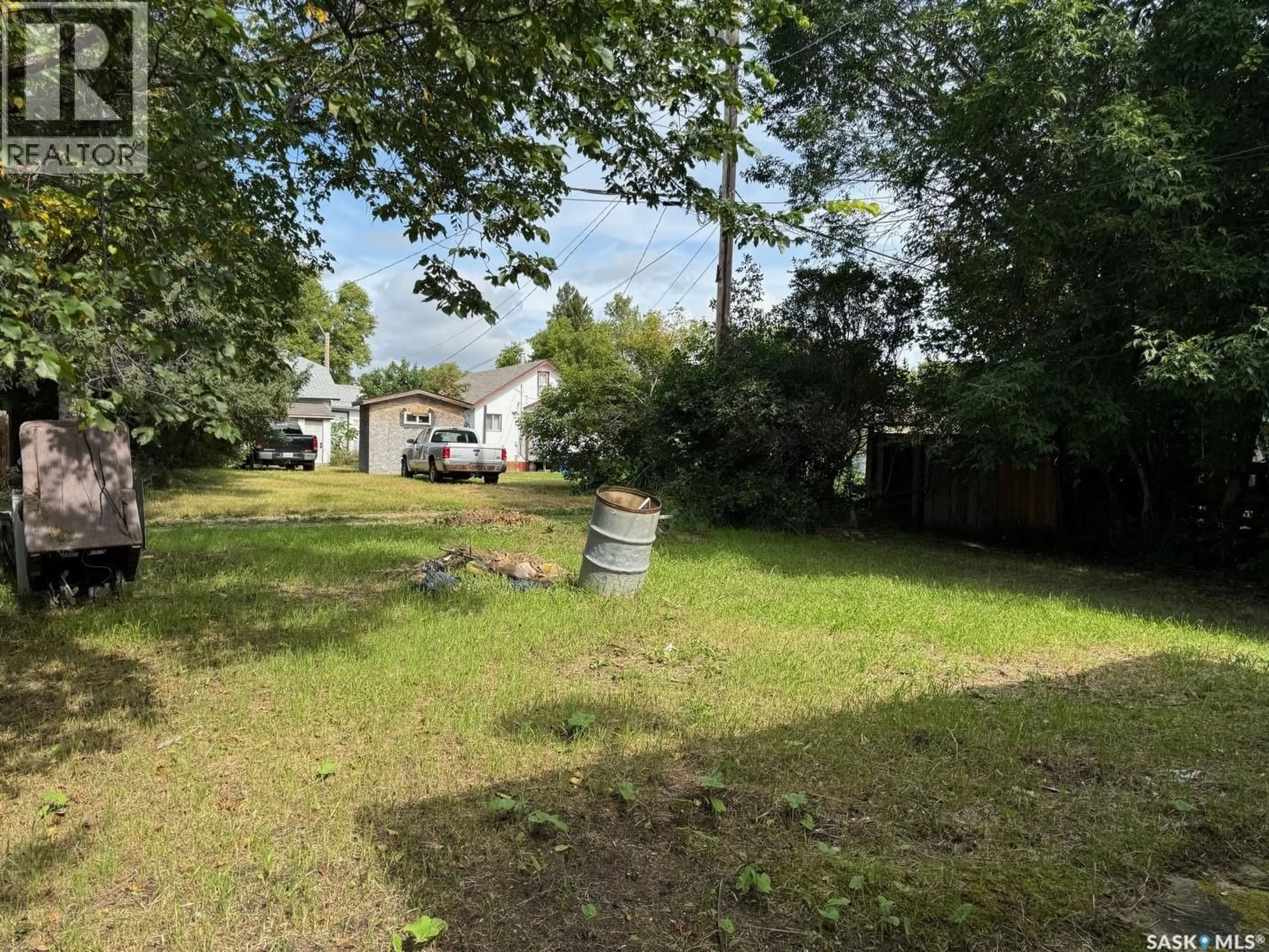 A pic from outside/outdoor area/front of a property/back of a property/a pic from drone, forest/trees view for 127 HARVEY STREET, Kamsack Saskatchewan S0A1S0