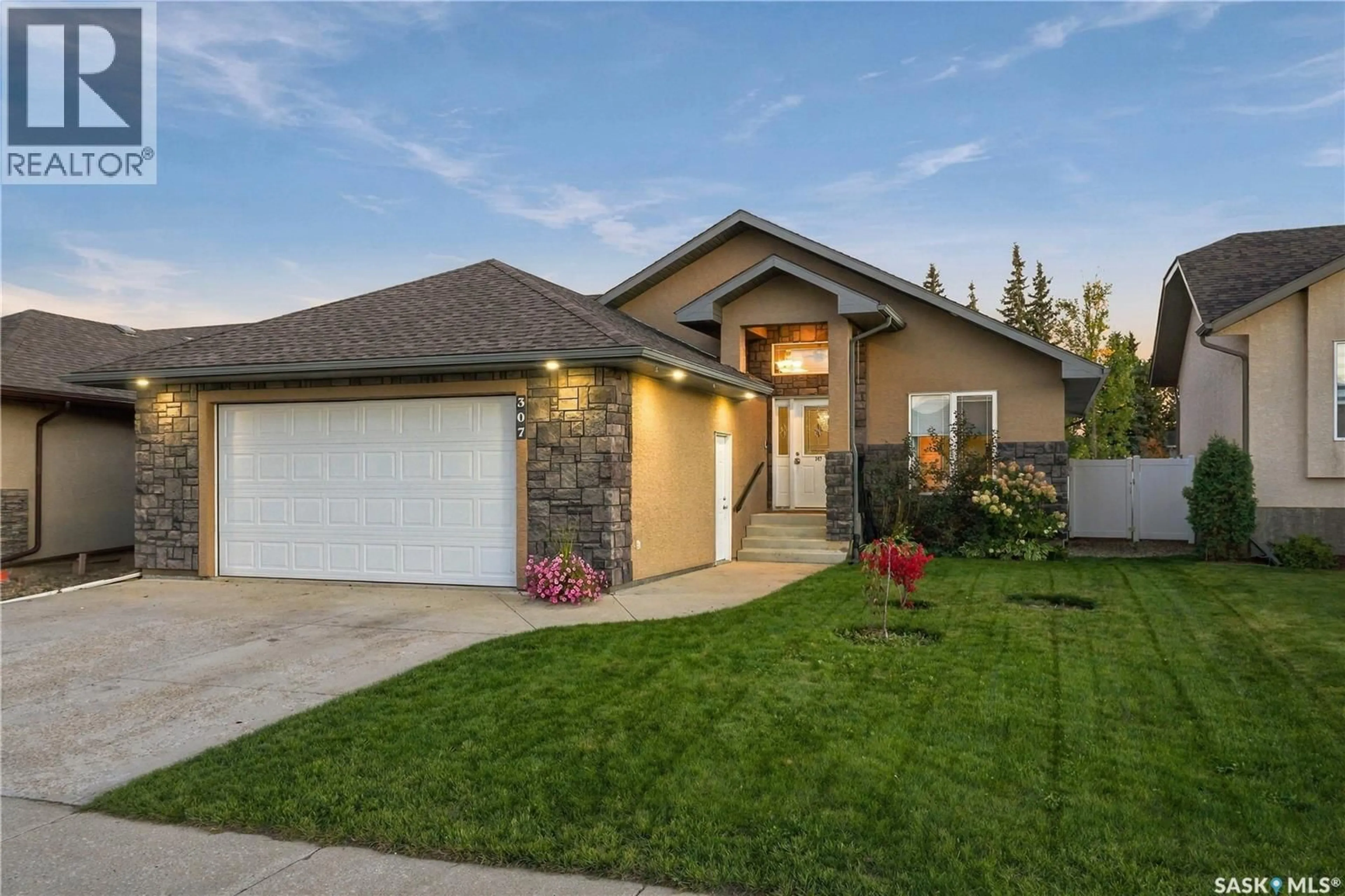 Home with brick exterior material, street for 307 FALDO CRESCENT, Warman Saskatchewan S0K4S1