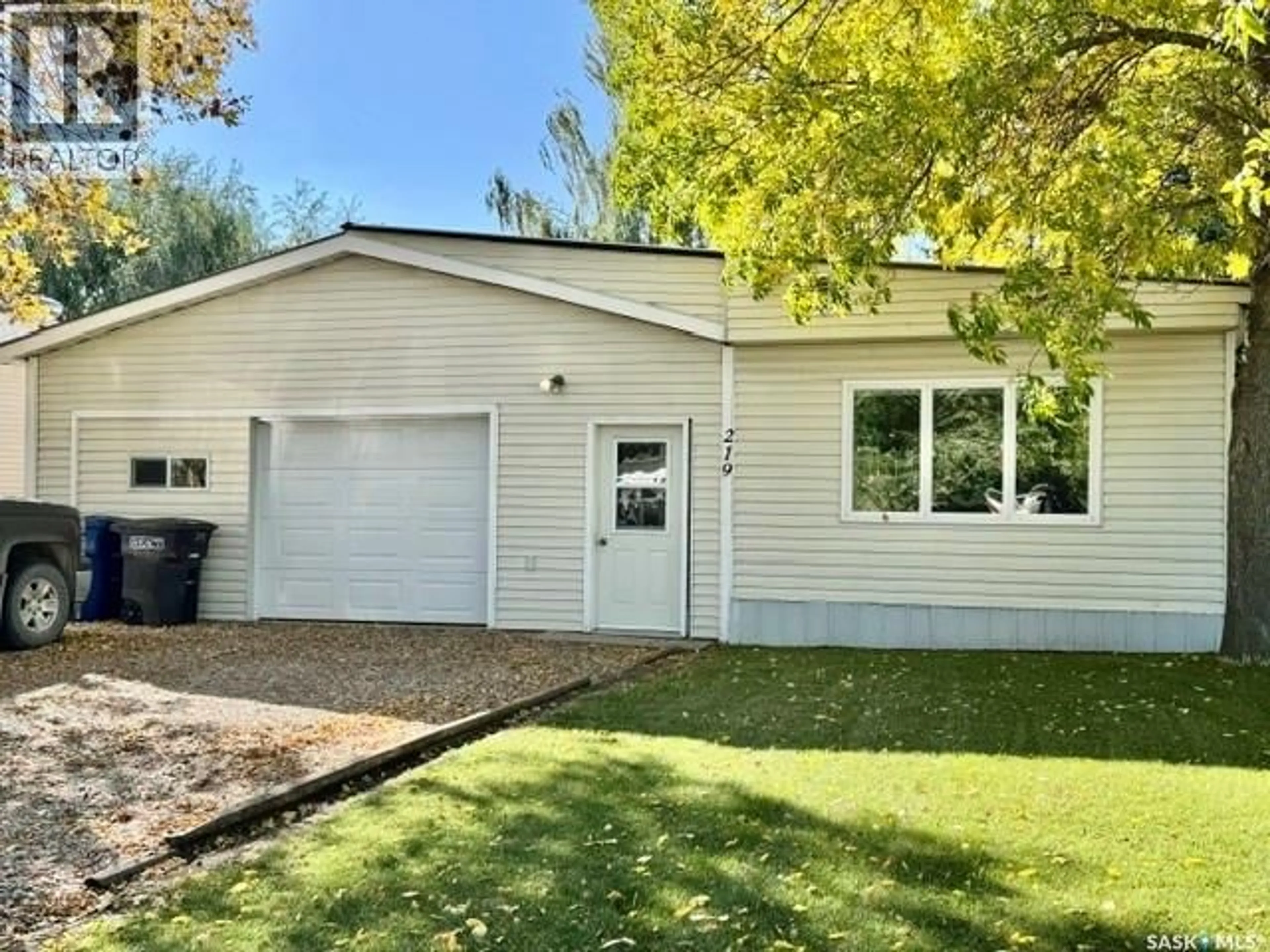 Home with vinyl exterior material, street for 219 13TH STREET, Humboldt Saskatchewan S0K2A0