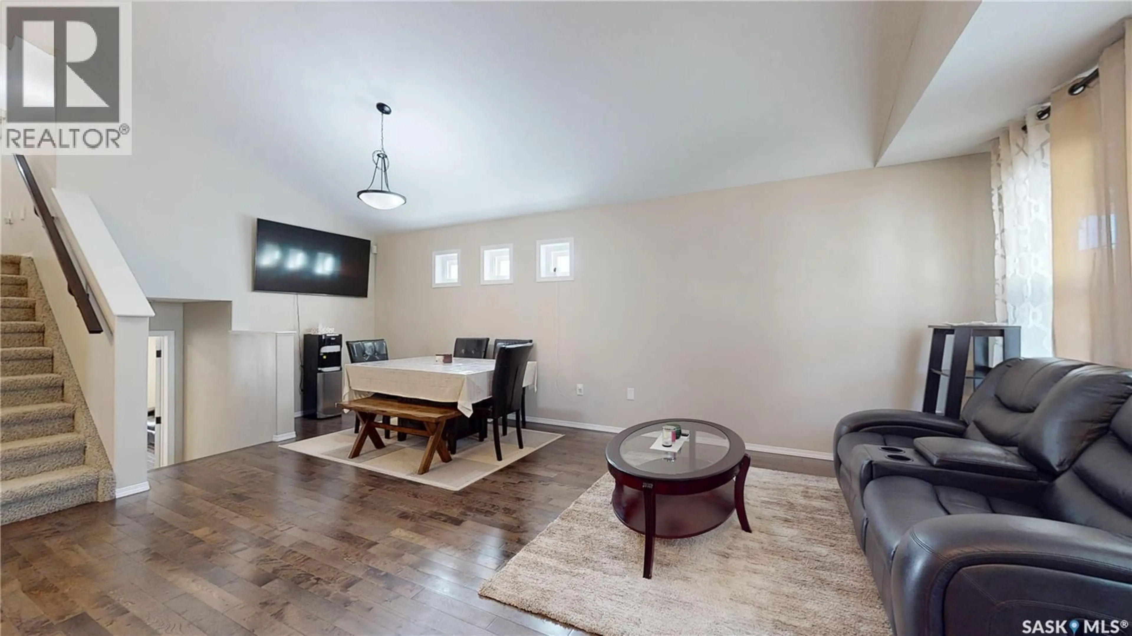 Living room with furniture, wood/laminate floor for 5321 MITCHINSON WAY, Regina Saskatchewan S4W0G8