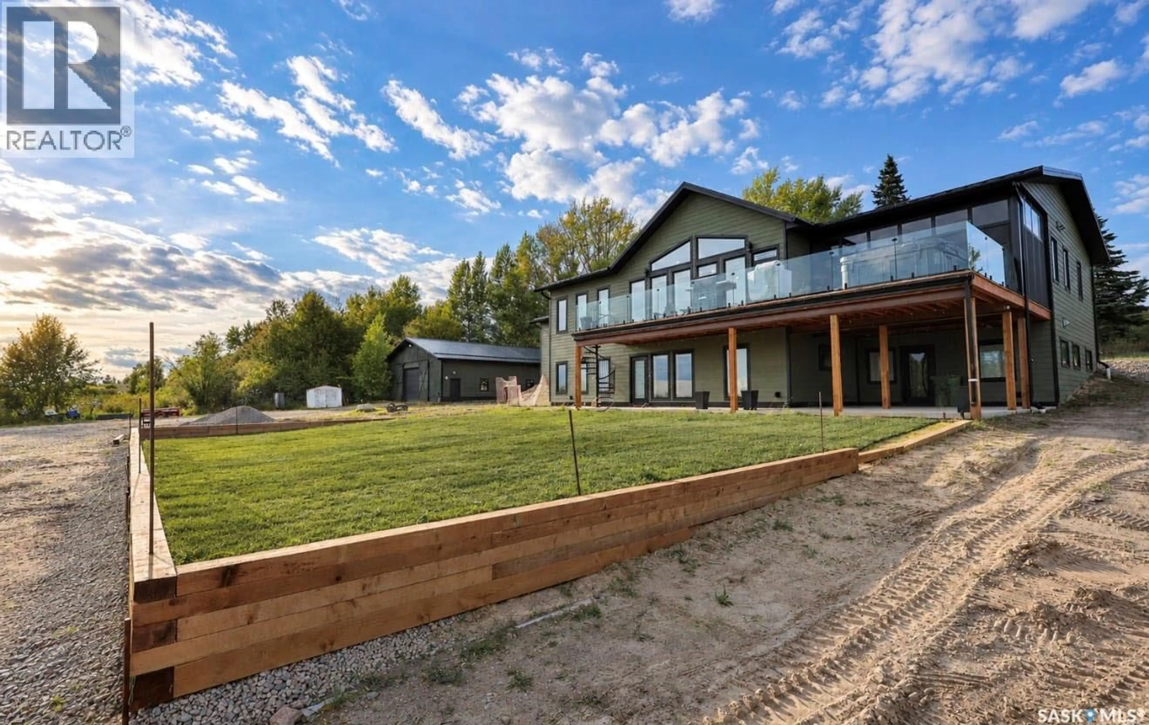 A pic from outside/outdoor area/front of a property/back of a property/a pic from drone, mountain view for 1515 BAY AVENUE, La Ronge Saskatchewan S0J1L0