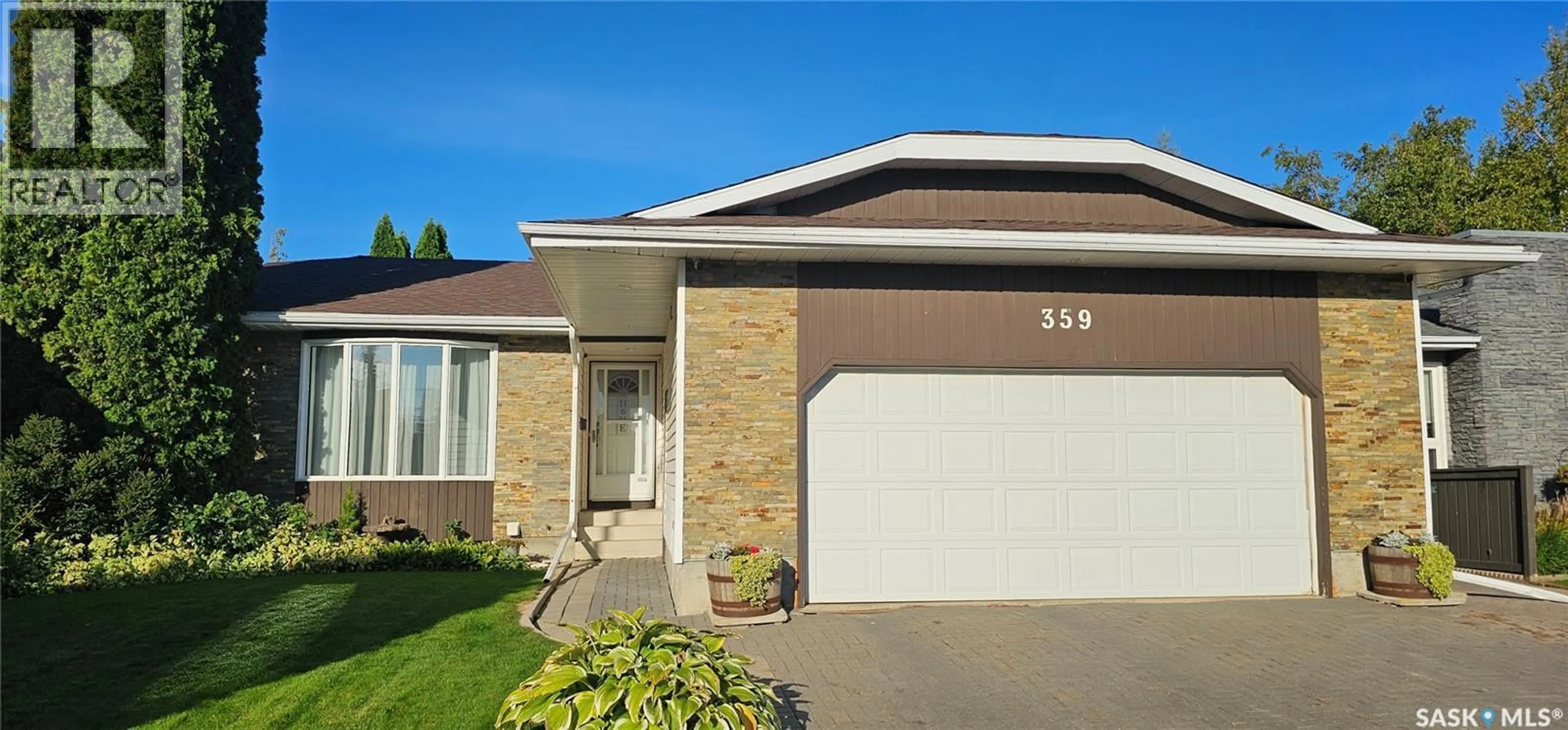 Home with brick exterior material, street for 359 NORDSTRUM ROAD, Saskatoon Saskatchewan S7K6P9