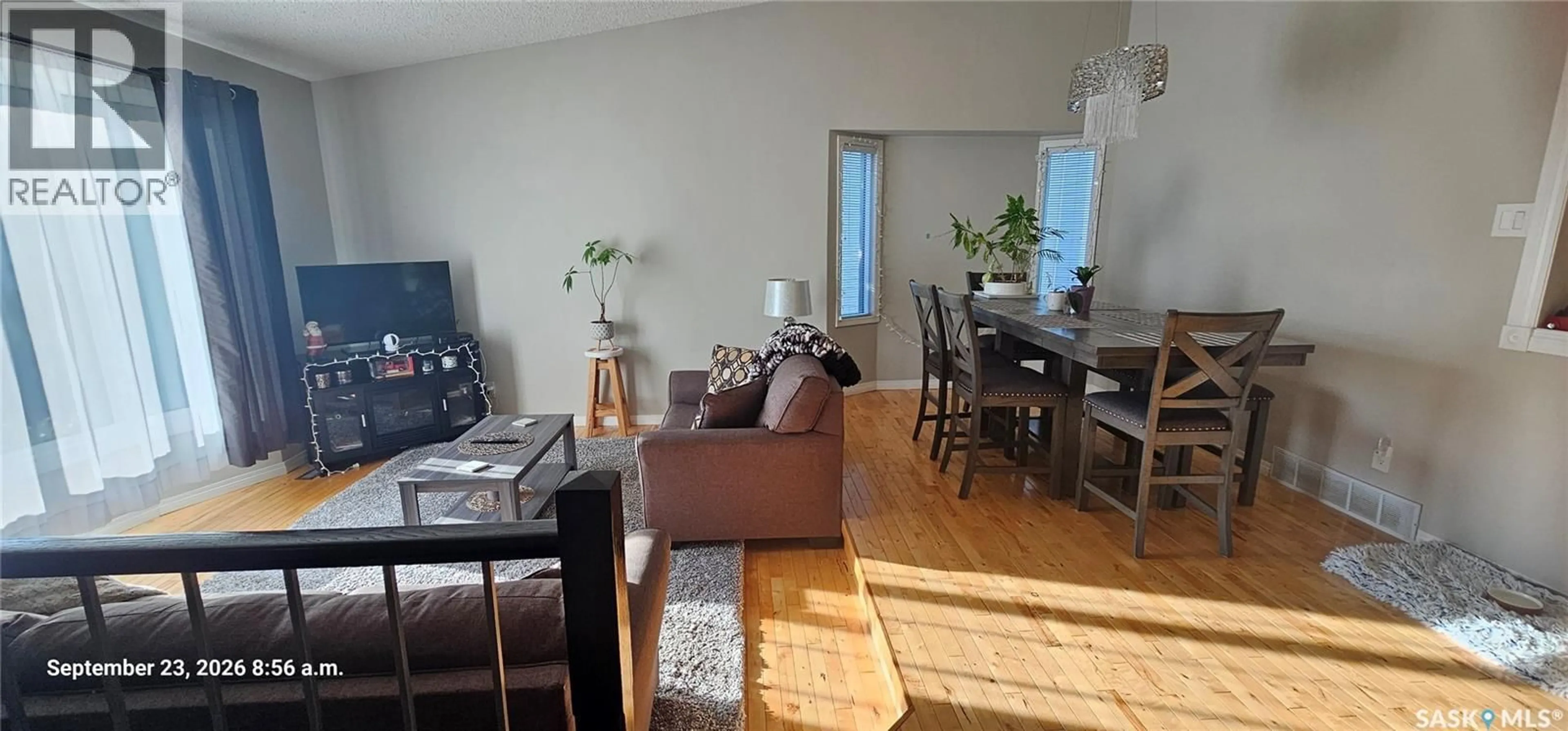 Living room with furniture, wood/laminate floor for 359 NORDSTRUM ROAD, Saskatoon Saskatchewan S7K6P9