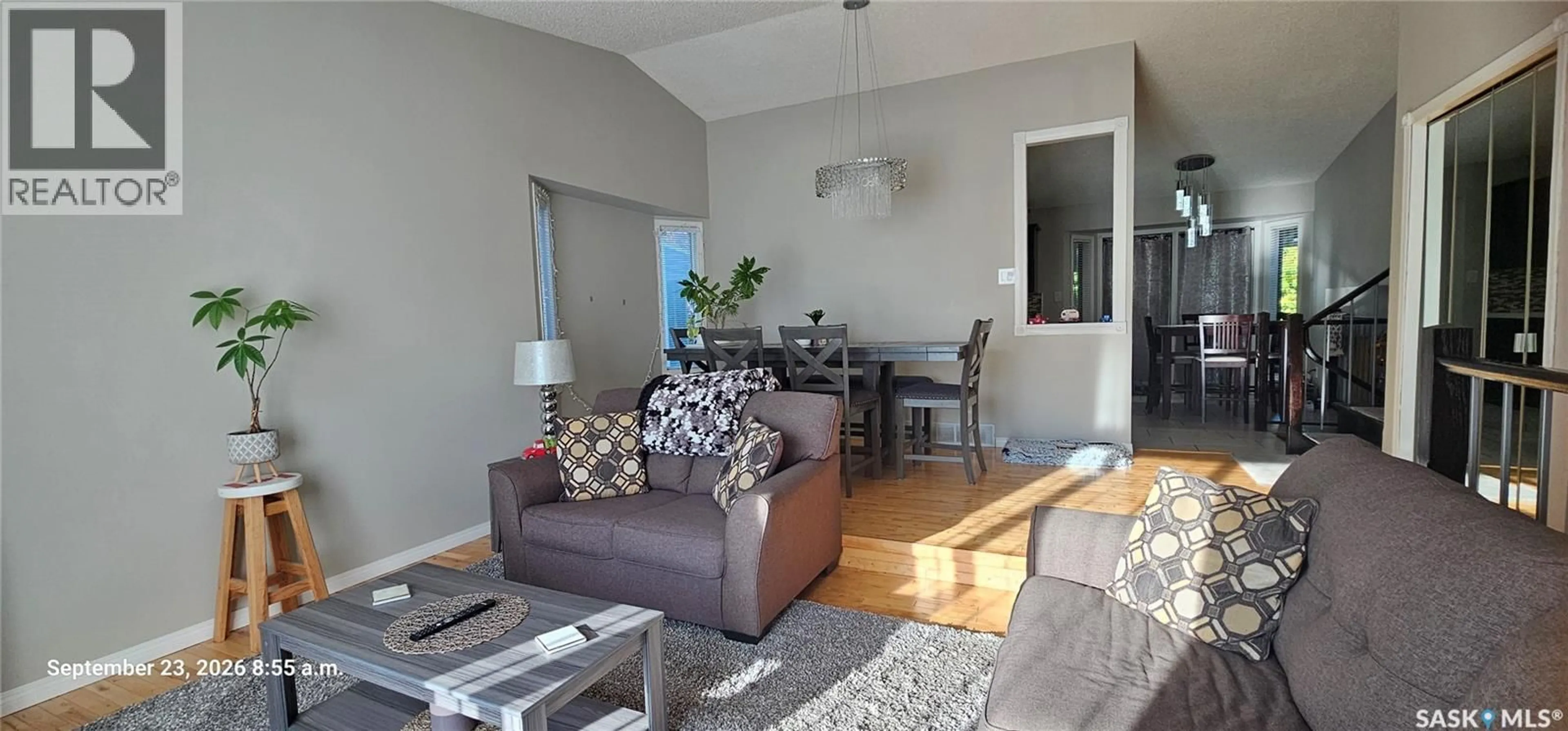 Living room with furniture, wood/laminate floor for 359 NORDSTRUM ROAD, Saskatoon Saskatchewan S7K6P9