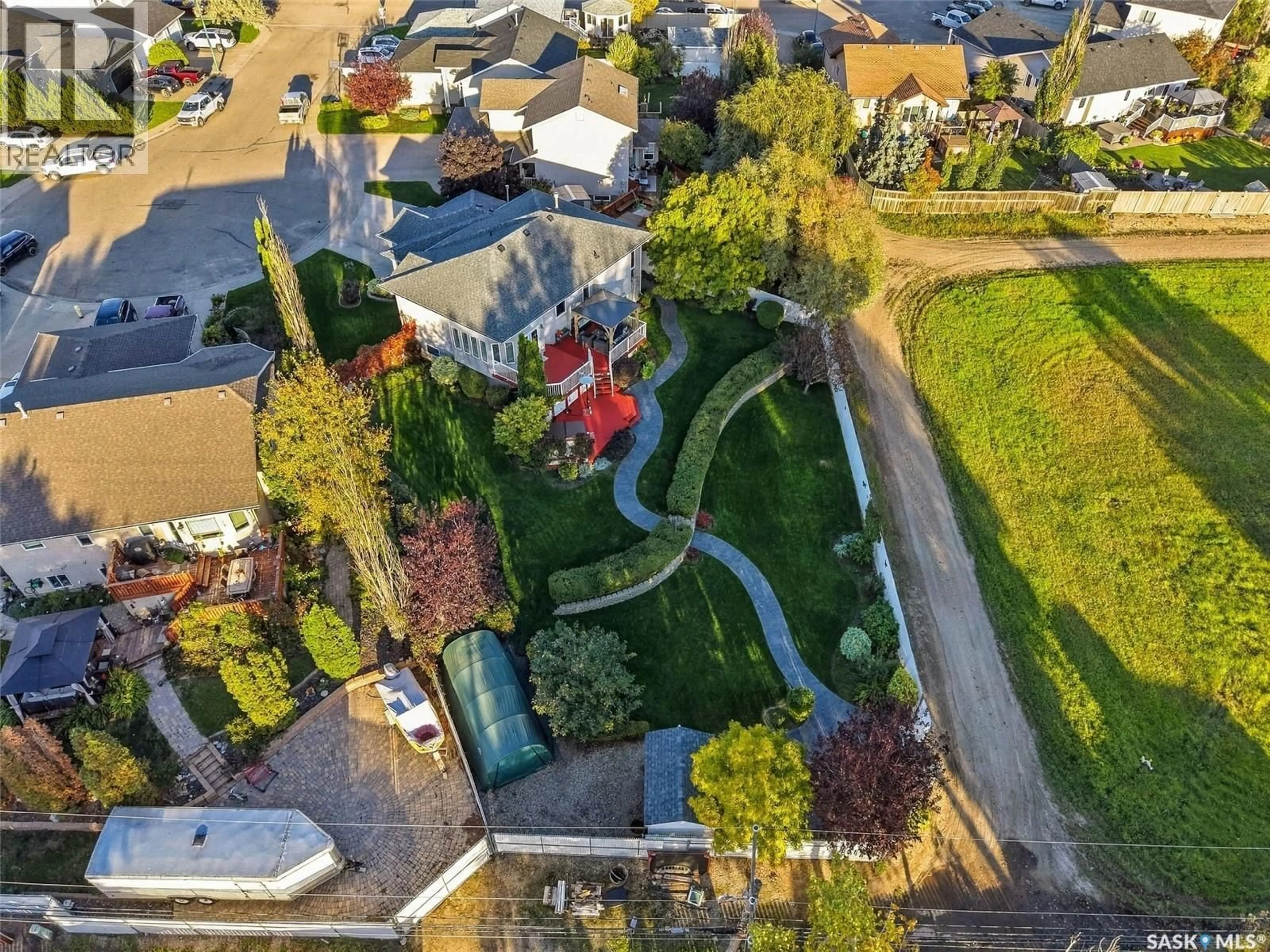 A pic from outside/outdoor area/front of a property/back of a property/a pic from drone, street for 726 PENNER PLACE, Martensville Saskatchewan S0K2T2