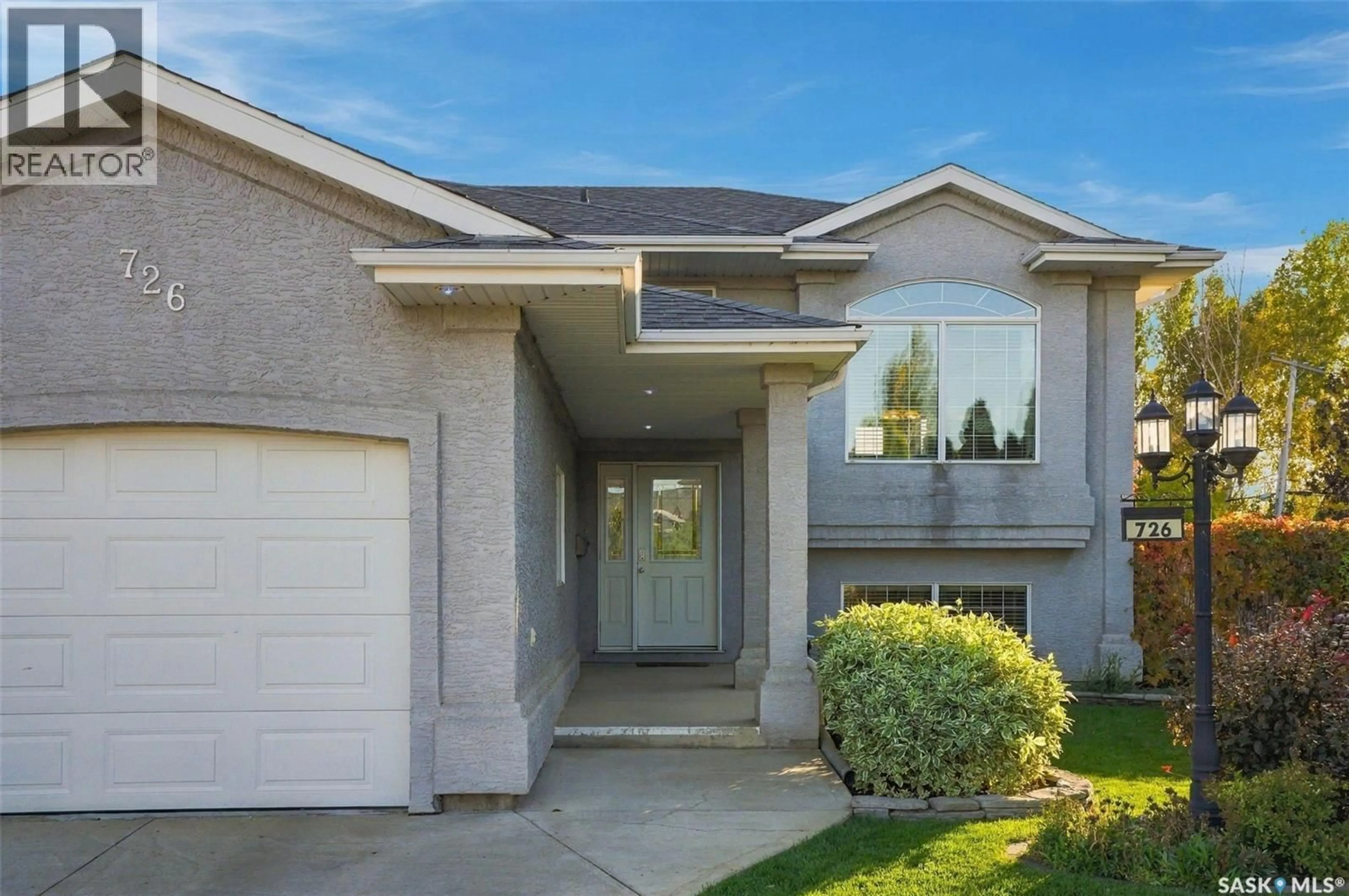 Home with brick exterior material, street for 726 PENNER PLACE, Martensville Saskatchewan S0K2T2