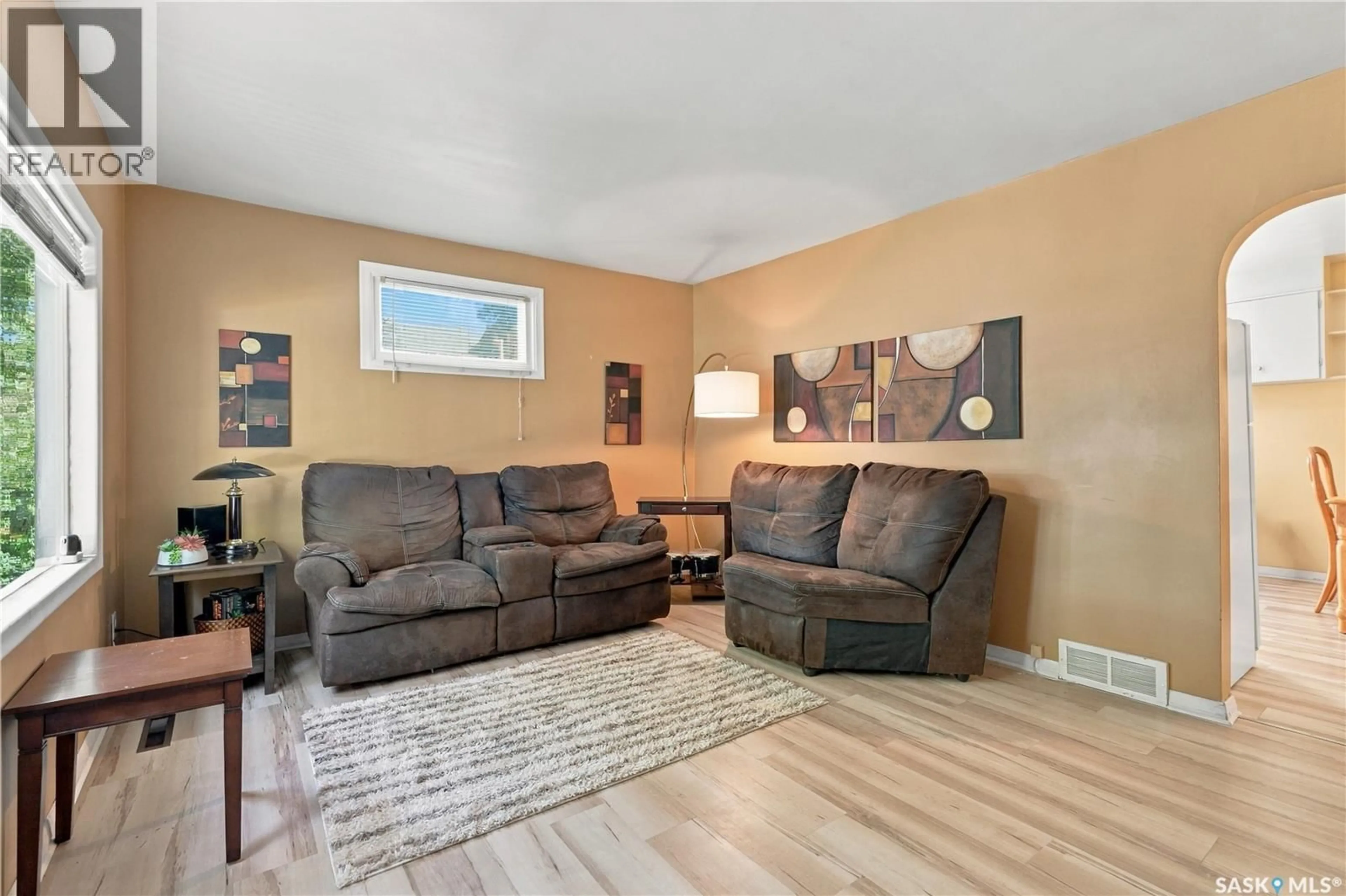 Living room with furniture, wood/laminate floor for 107 106TH STREET, Saskatoon Saskatchewan S7N1N4