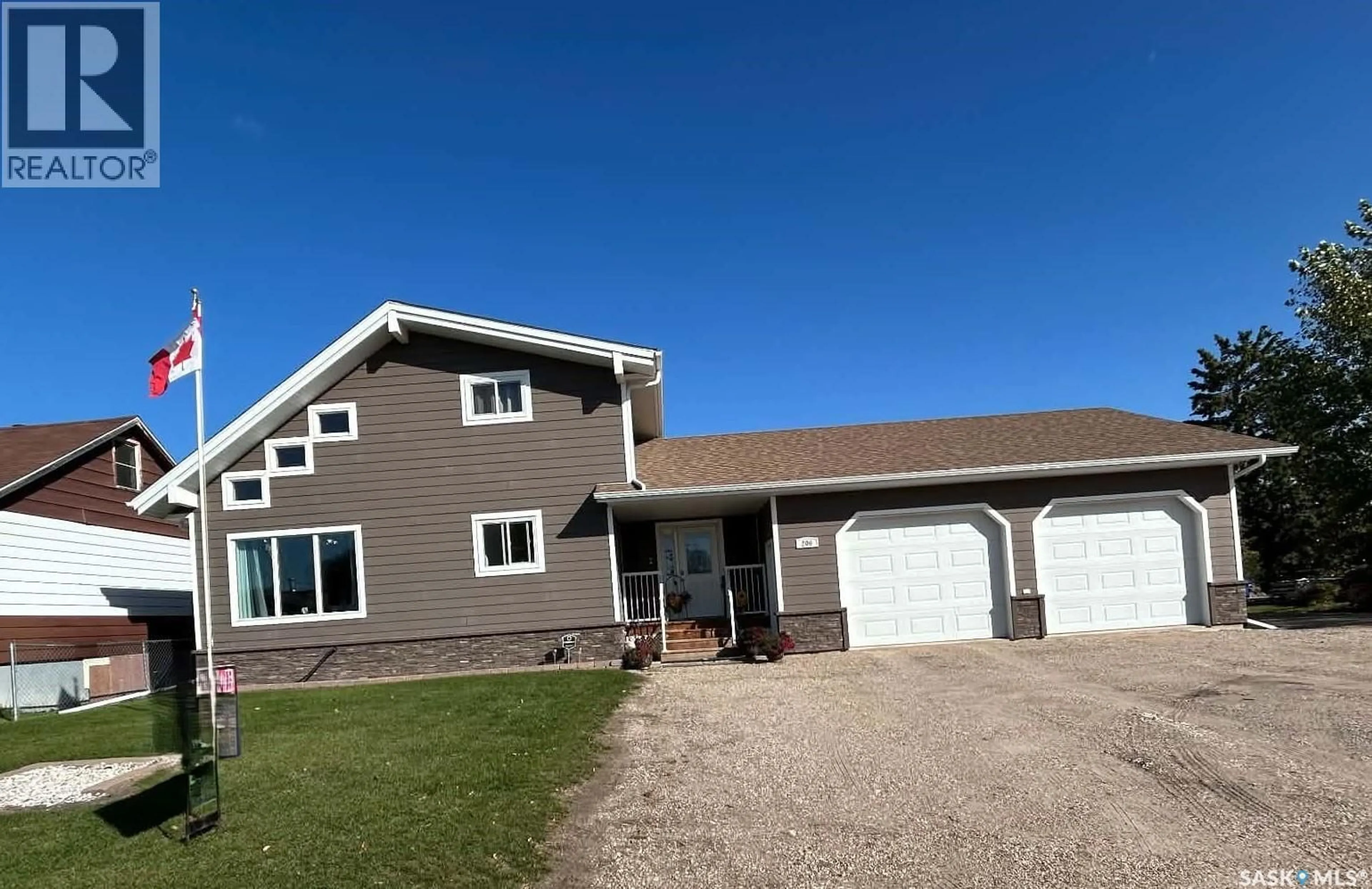 Home with vinyl exterior material, street for 206 2ND STREET, Carrot River Saskatchewan S0E0L0