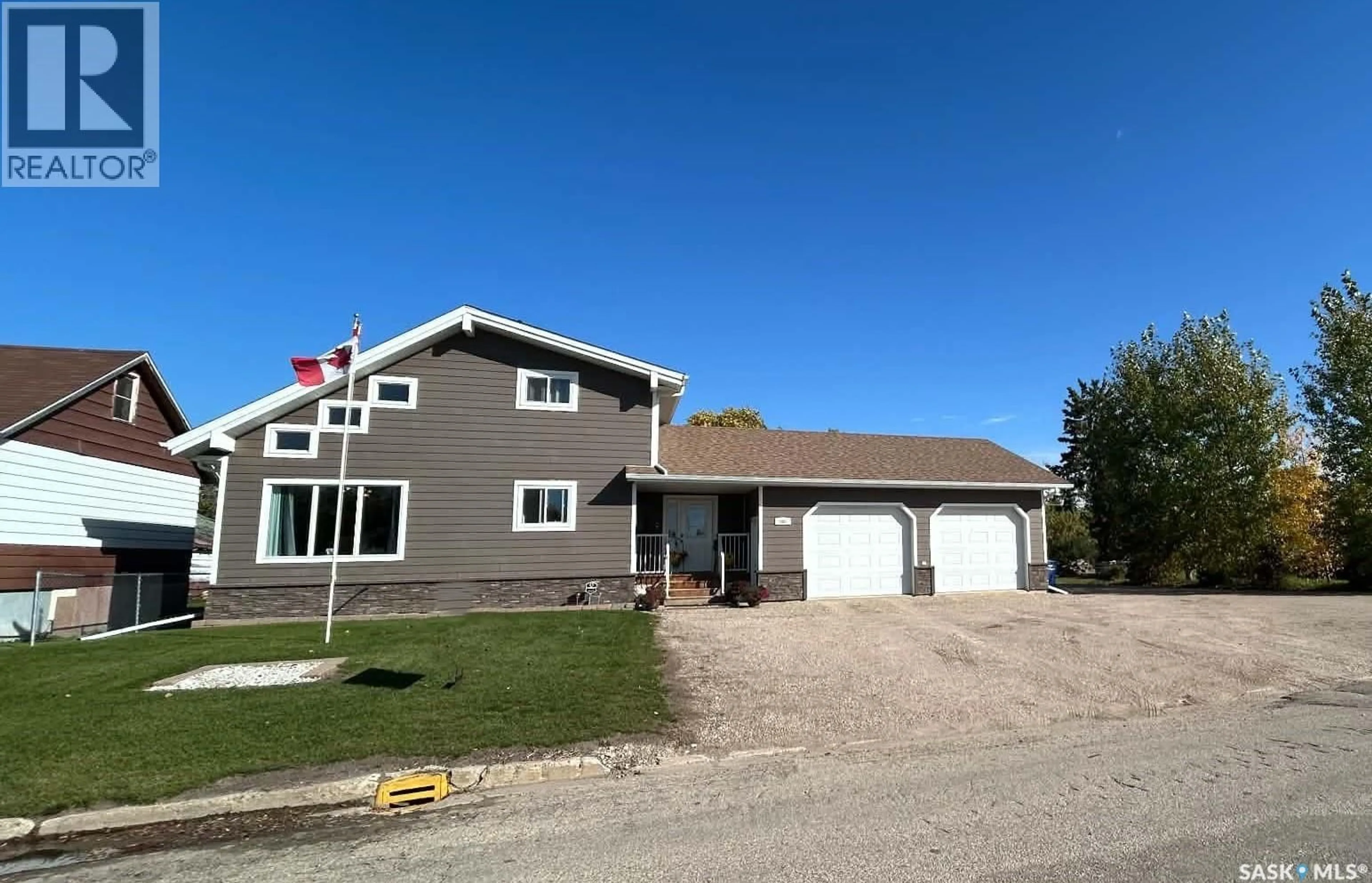 Home with vinyl exterior material, street for 206 2ND STREET, Carrot River Saskatchewan S0E0L0
