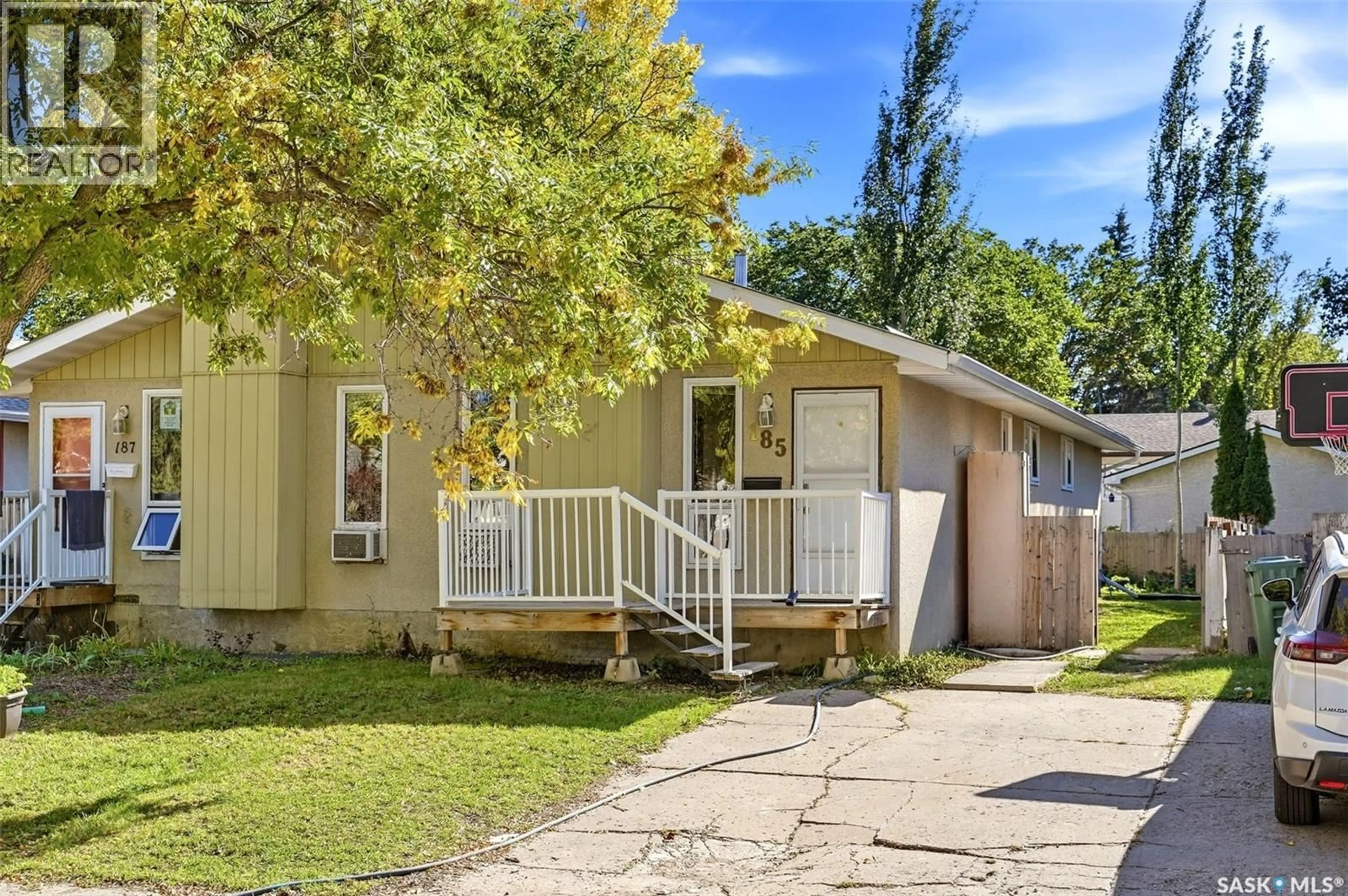 Home with vinyl exterior material, street for 185 THOMSON AVENUE, Regina Saskatchewan S4N5L2