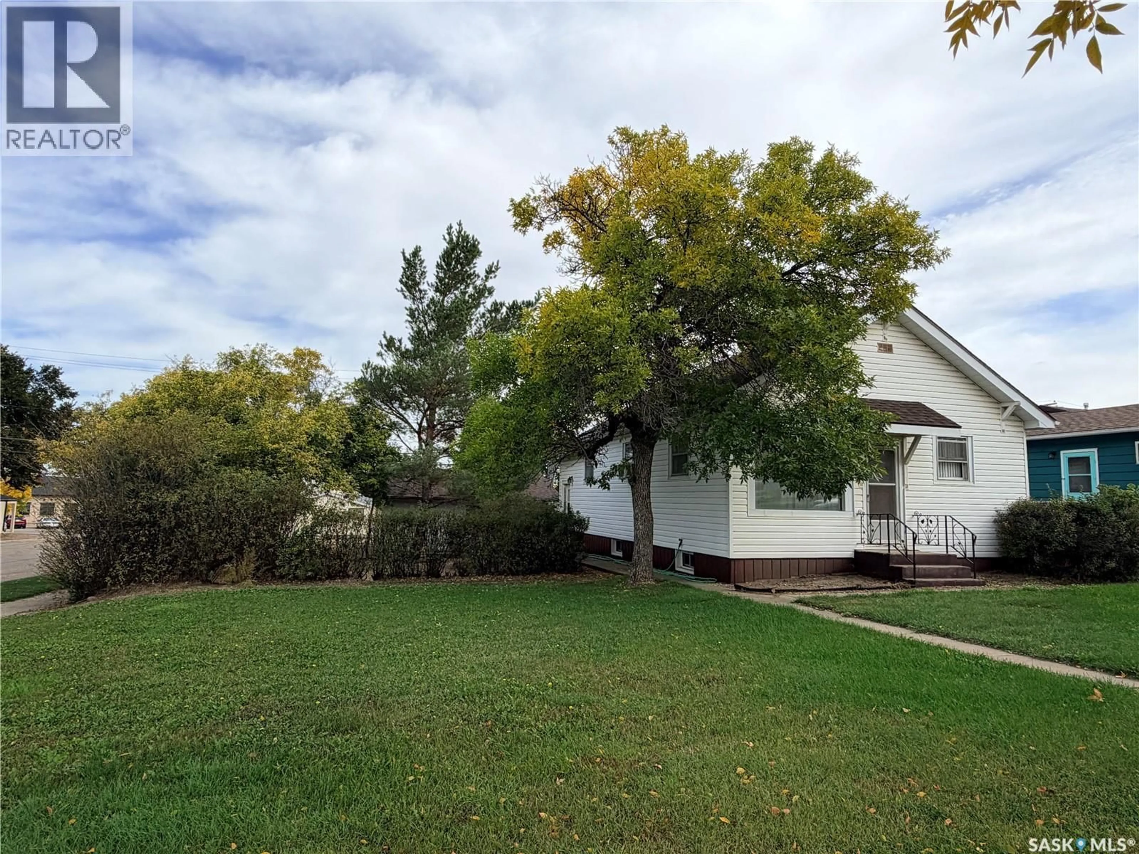A pic from outside/outdoor area/front of a property/back of a property/a pic from drone, mountain view for 203 4TH AVENUE, Assiniboia Saskatchewan S0H0B0
