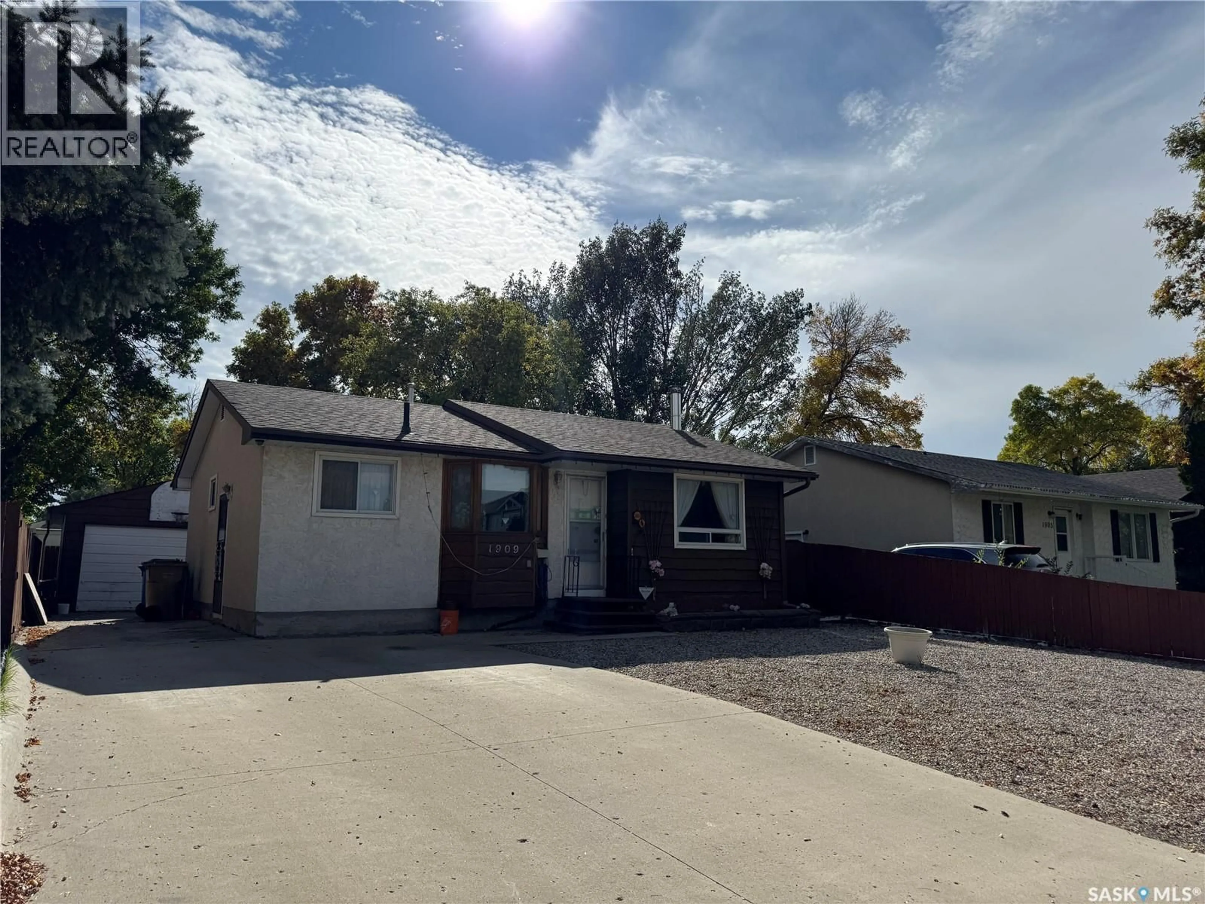 Home with vinyl exterior material, street for 1909 7TH AVENUE, Regina Saskatchewan S4N4M7