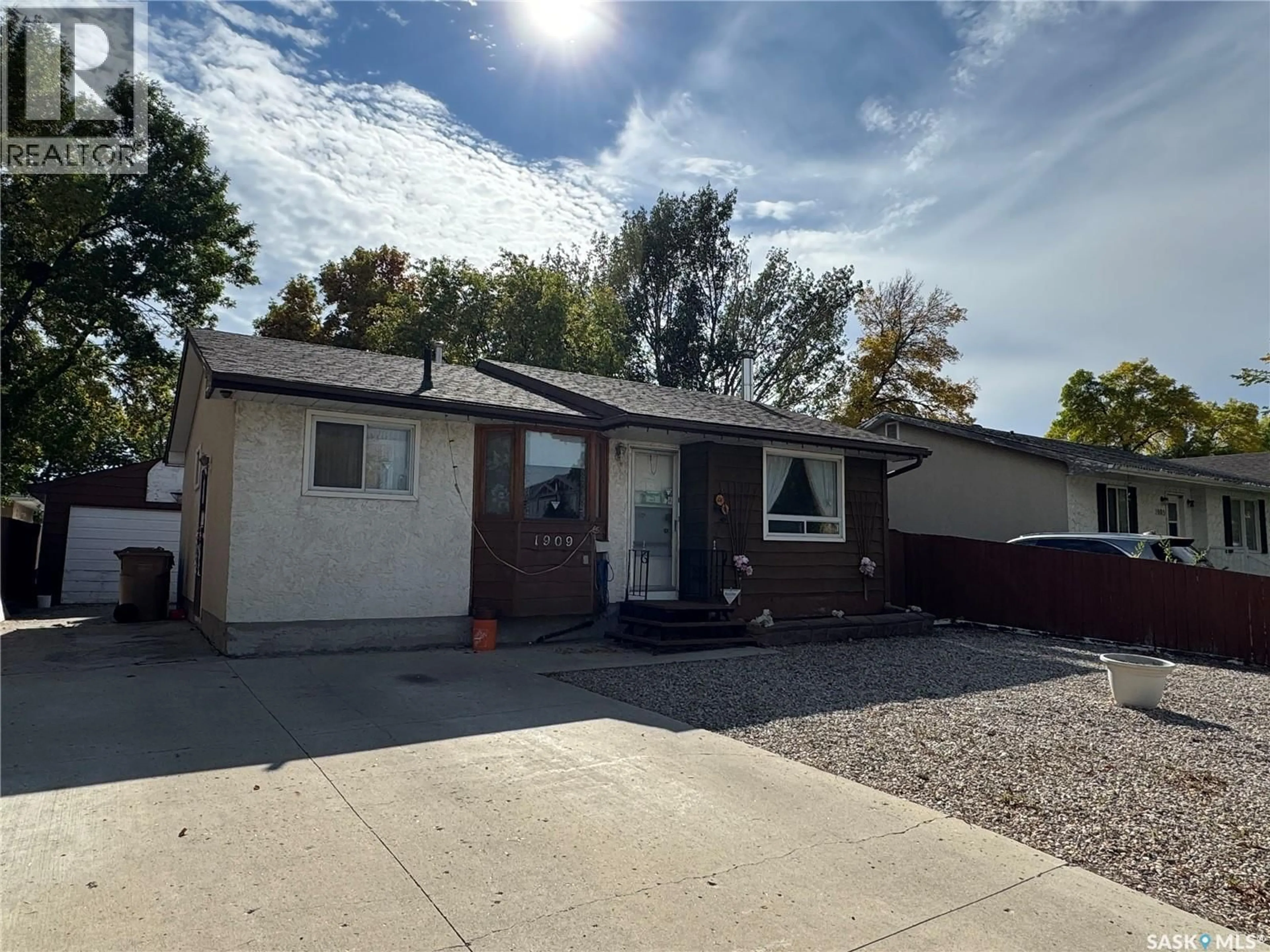 Home with vinyl exterior material, street for 1909 7TH AVENUE, Regina Saskatchewan S4N4M7