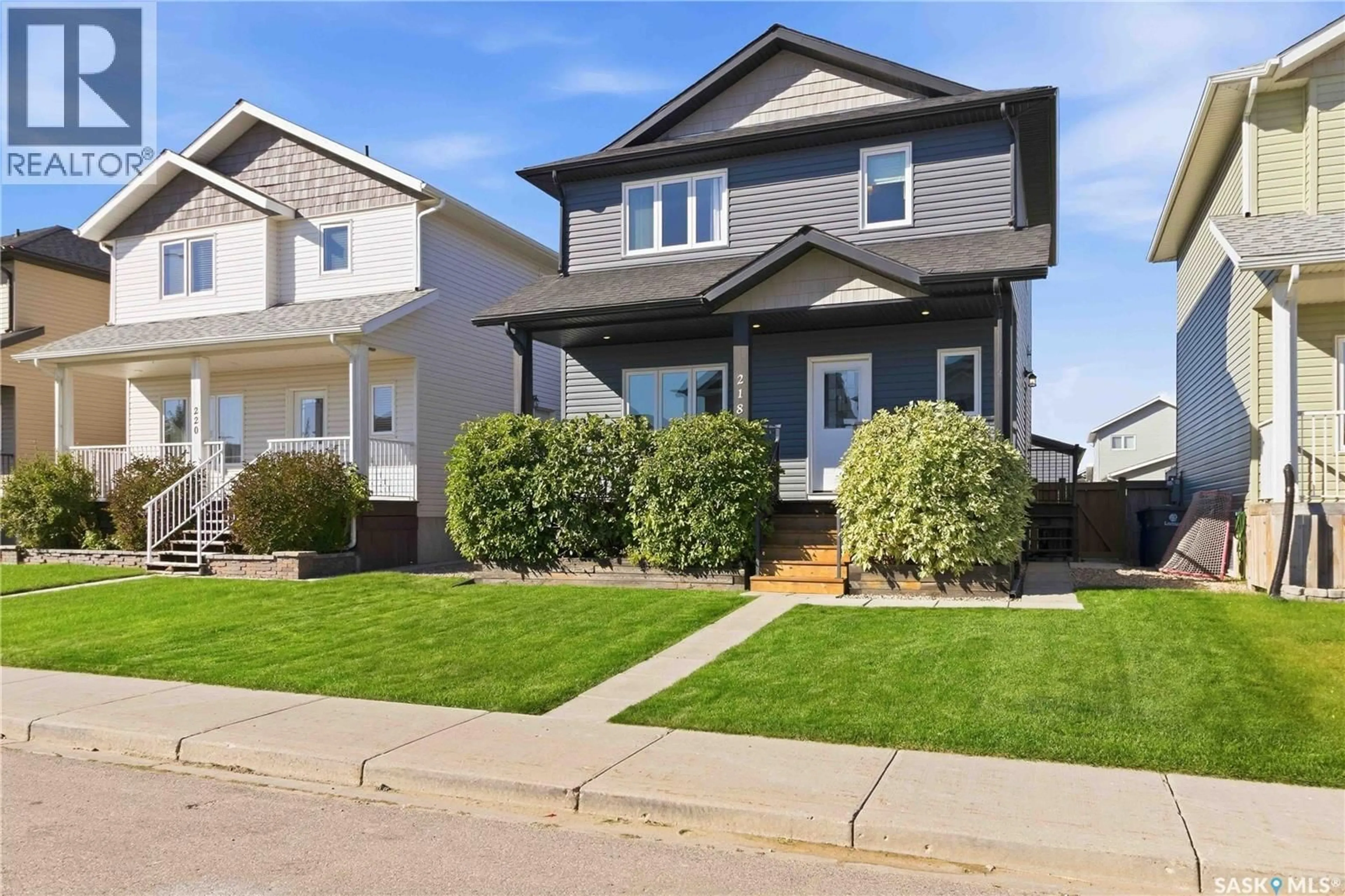 Home with vinyl exterior material, street for 218 MARTENS LANE, Warman Saskatchewan S0K4S3