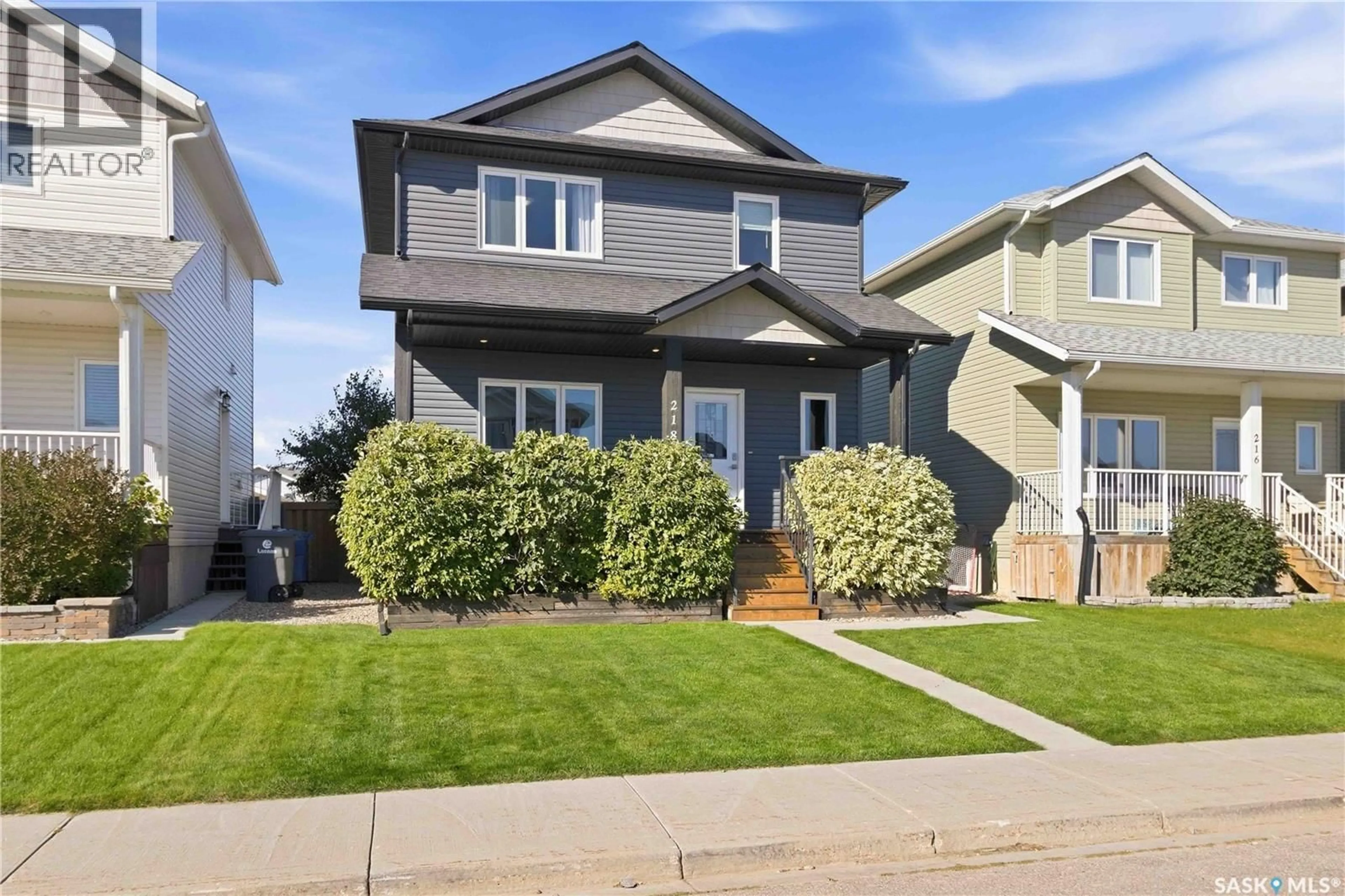 Home with vinyl exterior material, street for 218 MARTENS LANE, Warman Saskatchewan S0K4S3