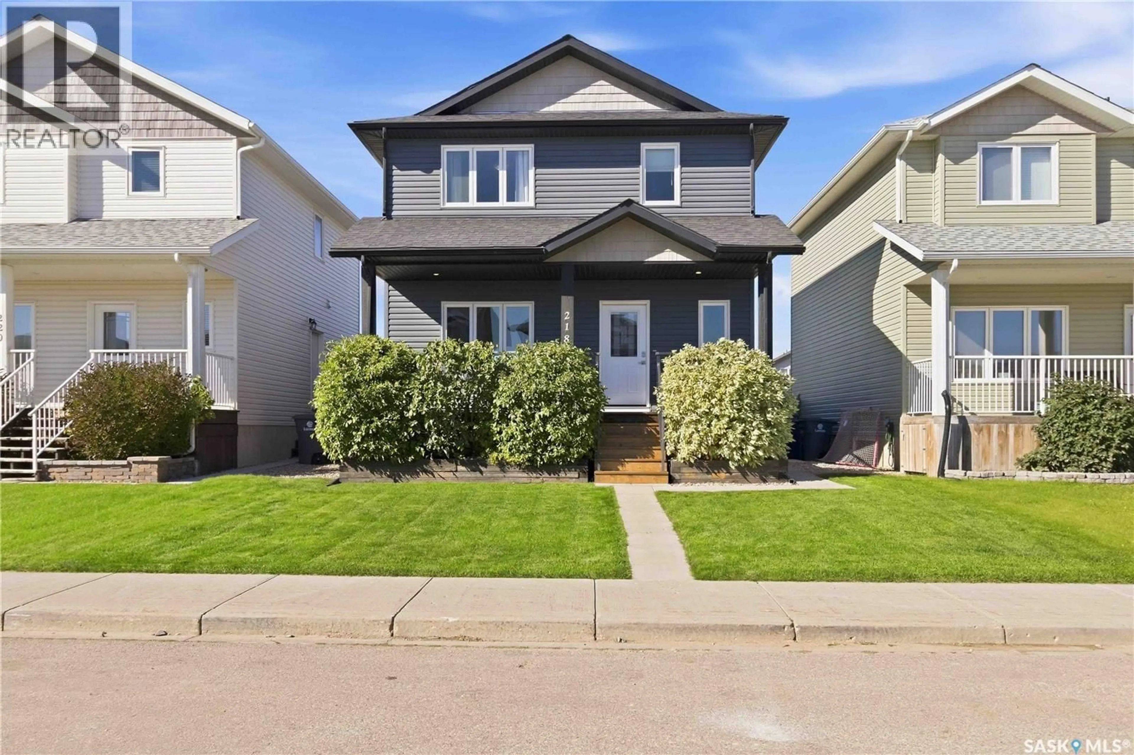 Home with vinyl exterior material, street for 218 MARTENS LANE, Warman Saskatchewan S0K4S3
