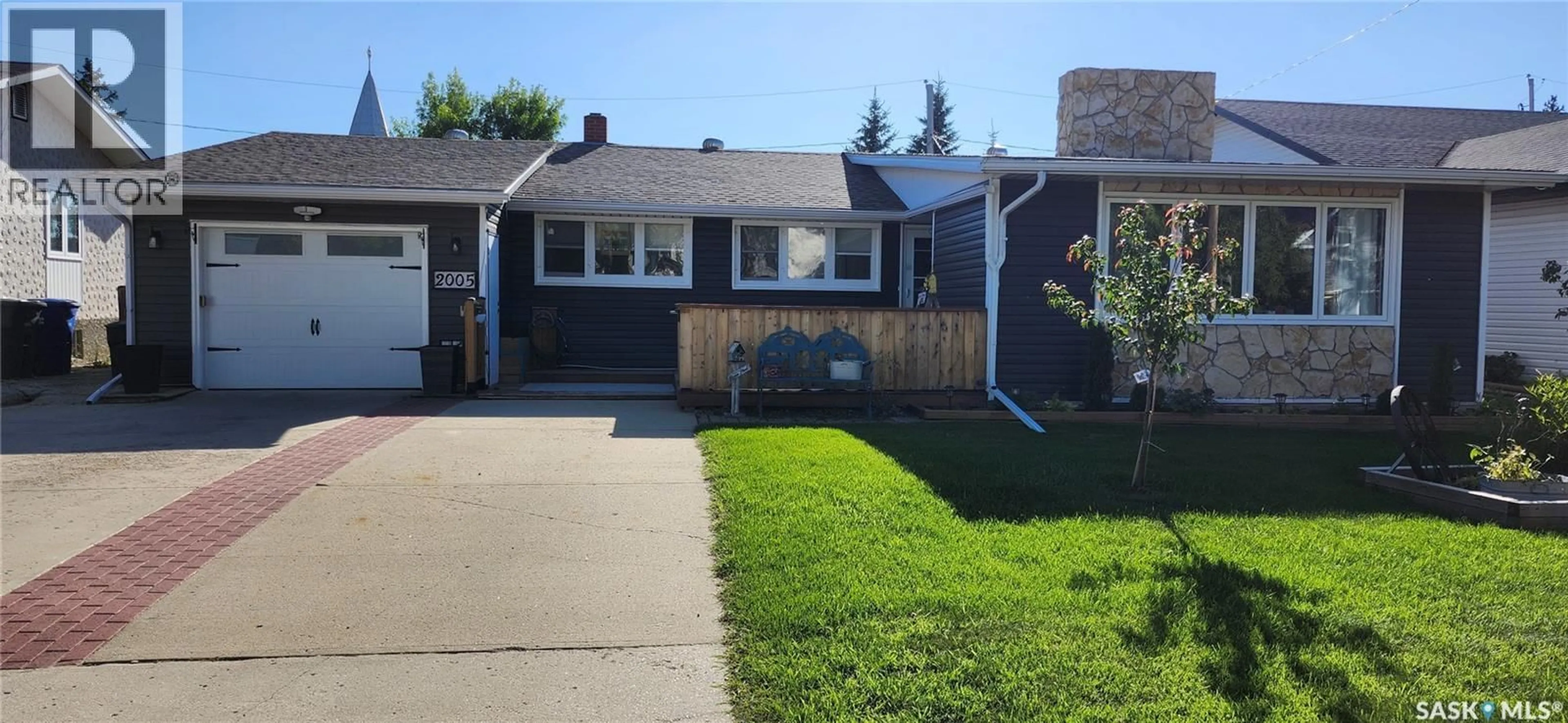 Home with vinyl exterior material, street for 2005 8TH STREET, Rosthern Saskatchewan S0K3R0