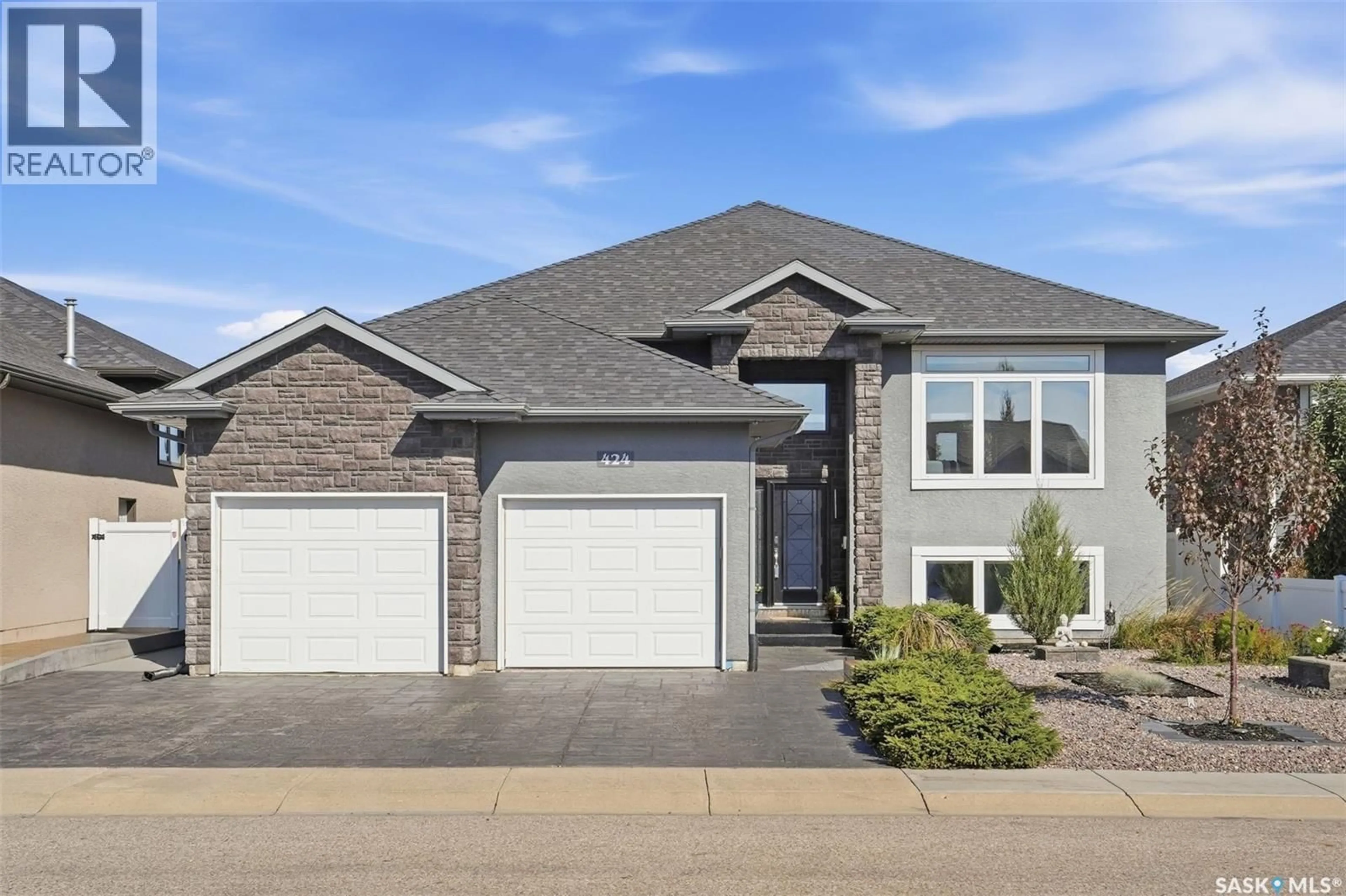 Home with brick exterior material, street for 424 FALDO CRESCENT, Warman Saskatchewan S0K4S1