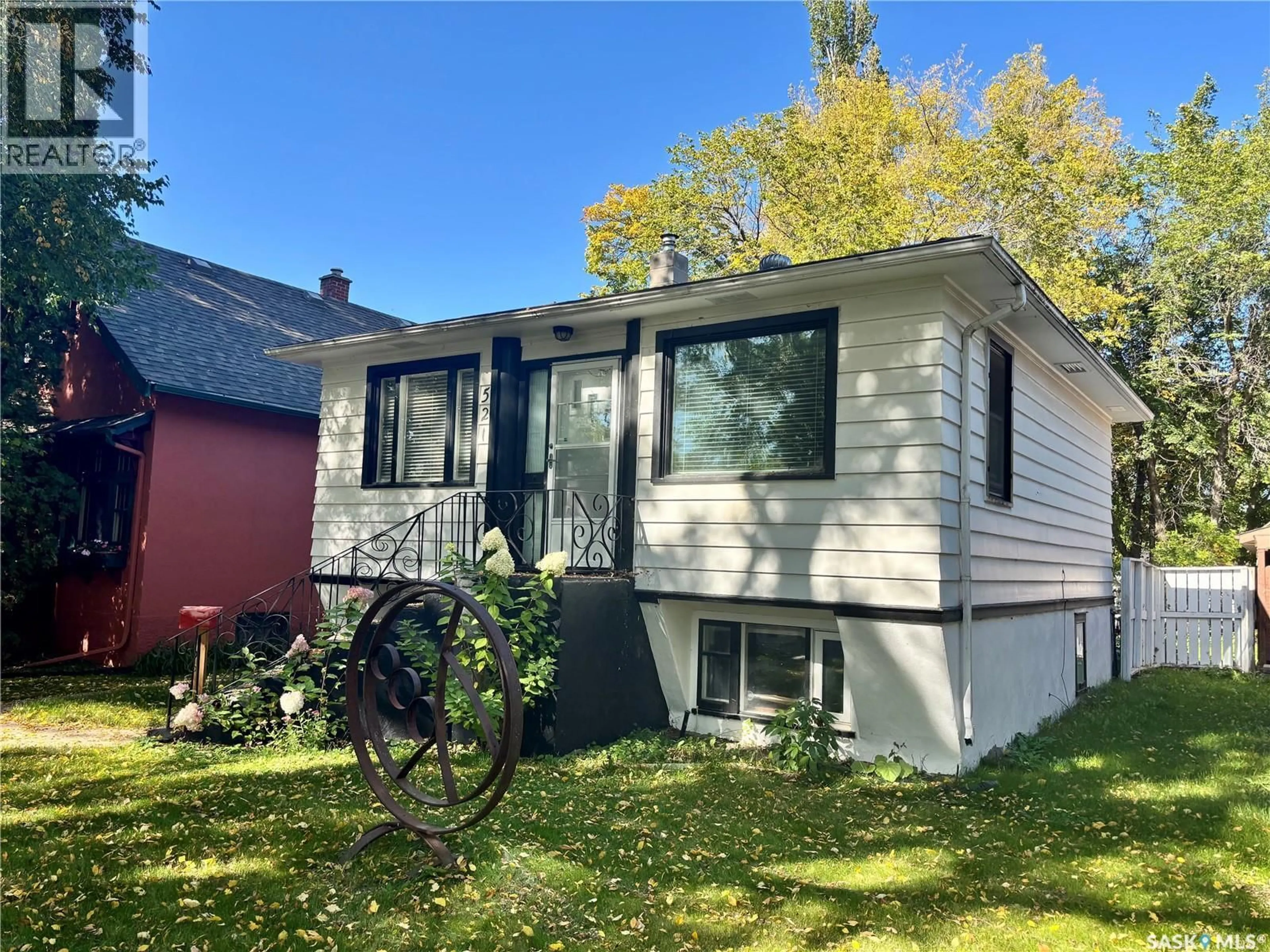 Home with vinyl exterior material, street for 521 5TH STREET, Saskatoon Saskatchewan S7H1G2