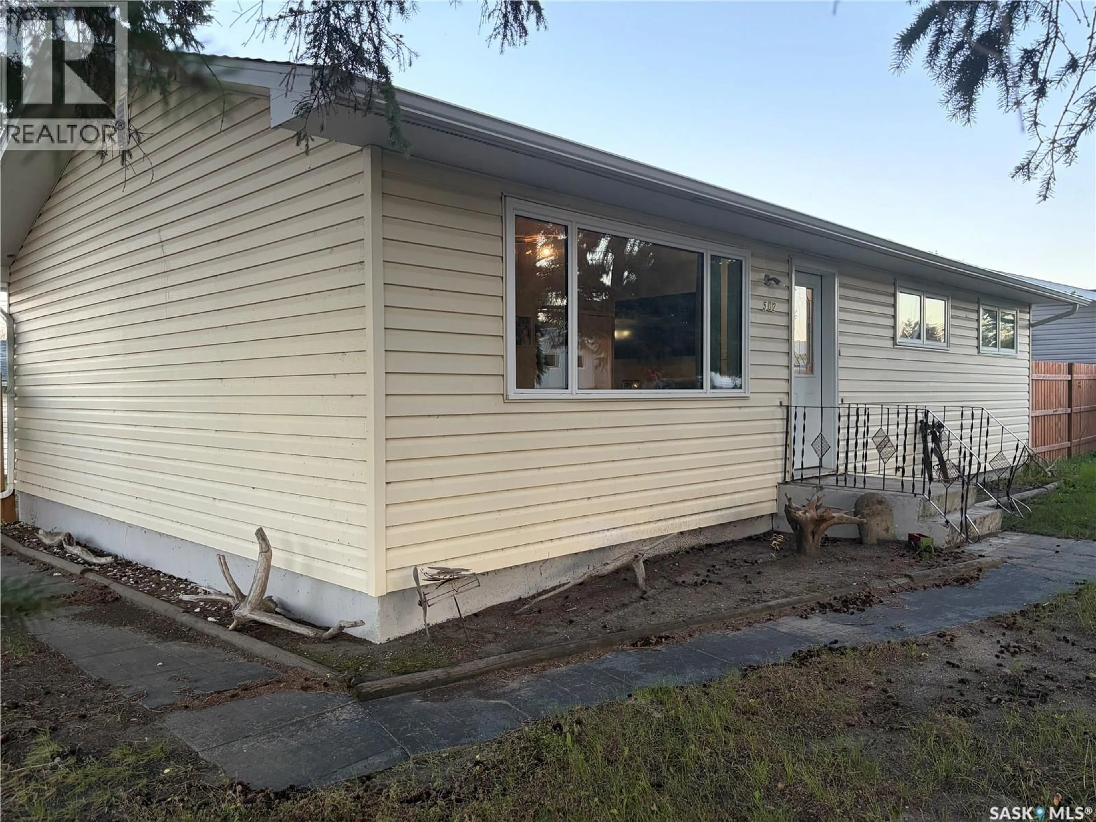 Home with vinyl exterior material, street for 502 6TH STREET, Wynyard Saskatchewan S0A4T0