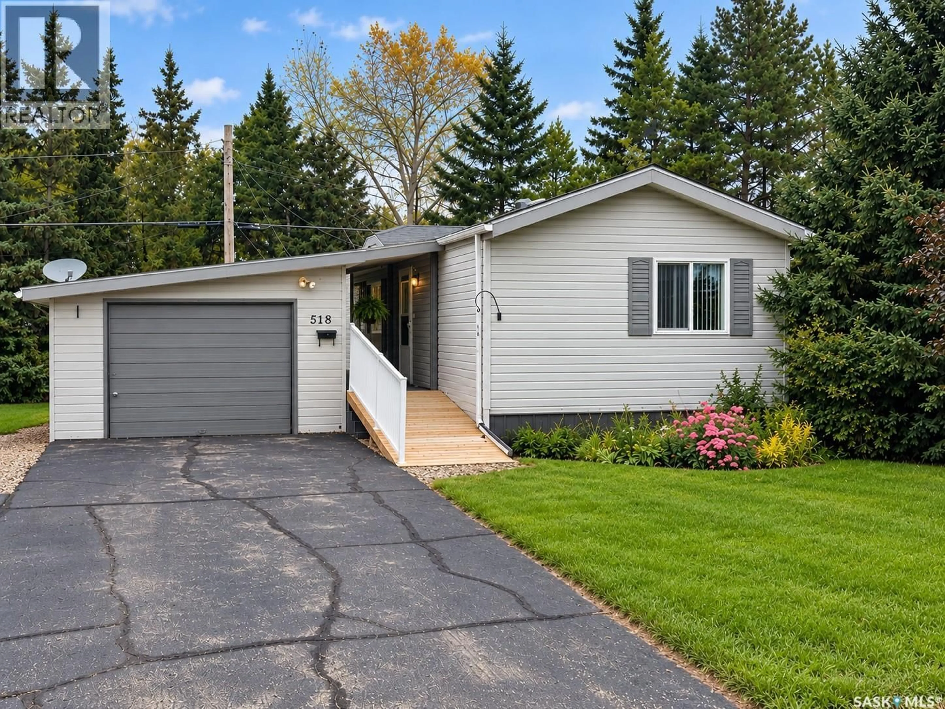 Home with vinyl exterior material, street for E - 518 MARCH AVENUE, Langenburg Saskatchewan S0A2A0