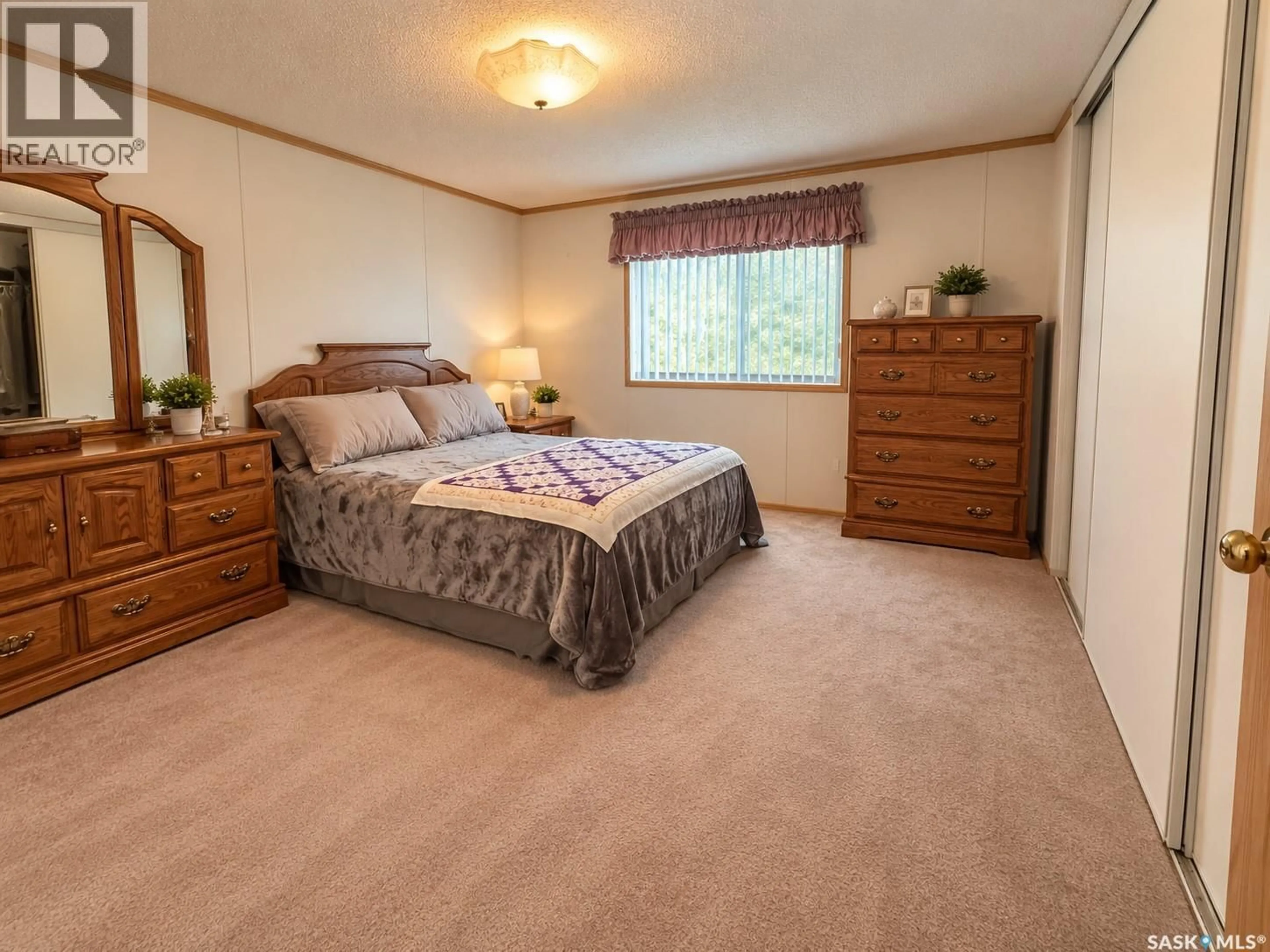 Bedroom with bed, carpet floor for E - 518 MARCH AVENUE, Langenburg Saskatchewan S0A2A0