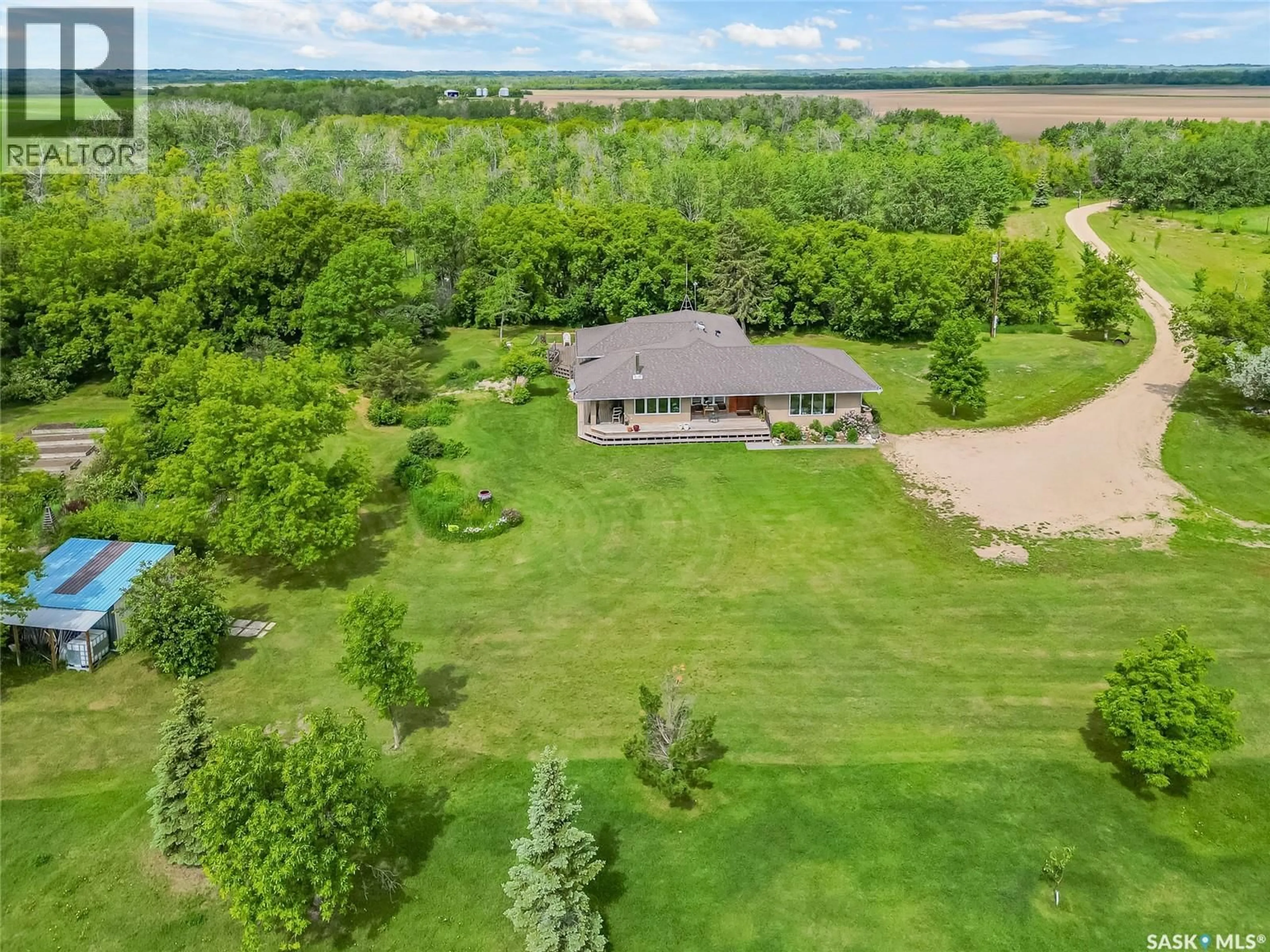 A pic from outside/outdoor area/front of a property/back of a property/a pic from drone, water/lake/river/ocean view for Fung ACREAGE, Dundurn Rm No. 314 Saskatchewan S7K1M2