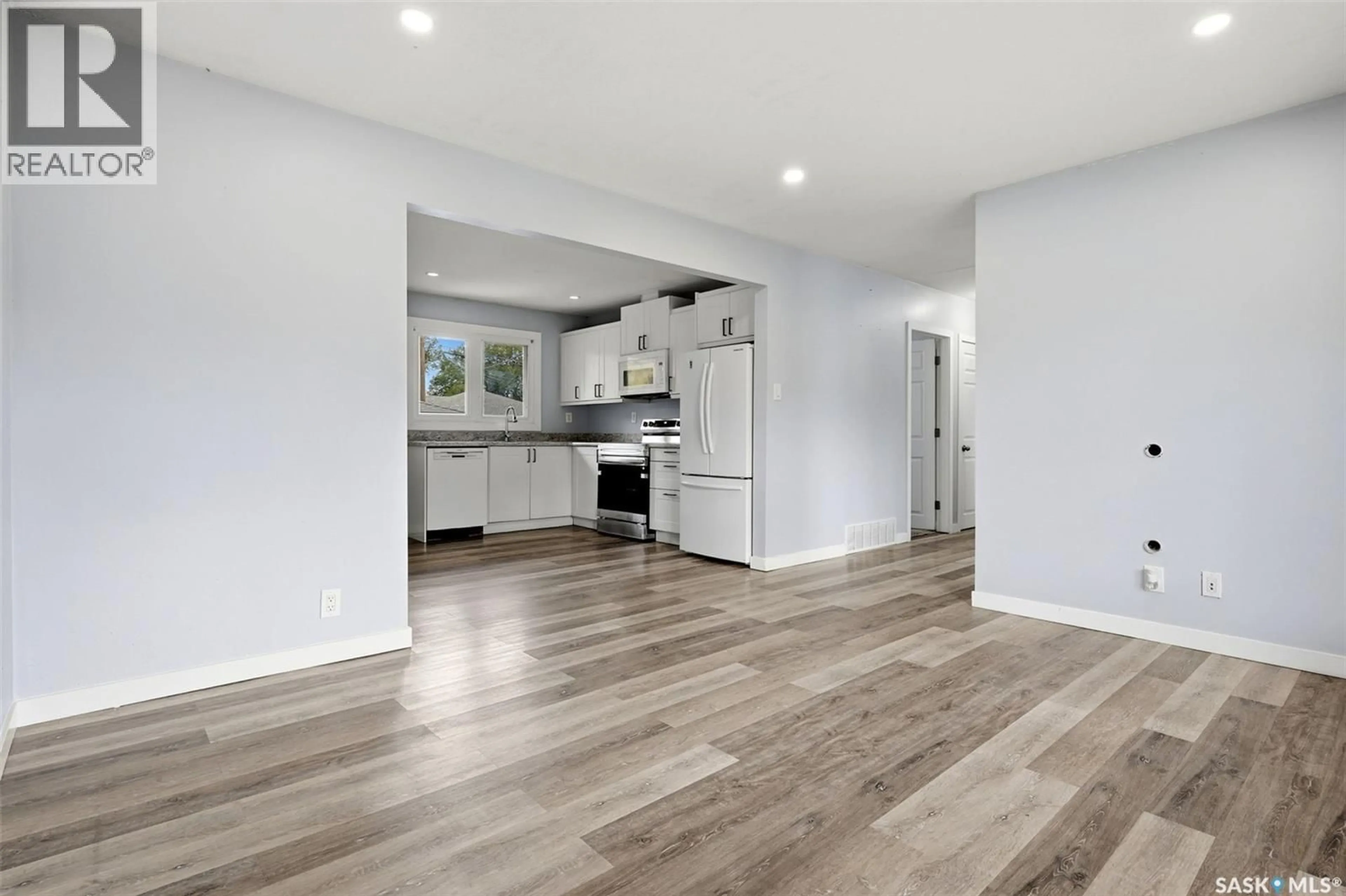 Open concept kitchen, wood/laminate floor for 2 SAMPSON PLACE, Regina Saskatchewan S4R4R4