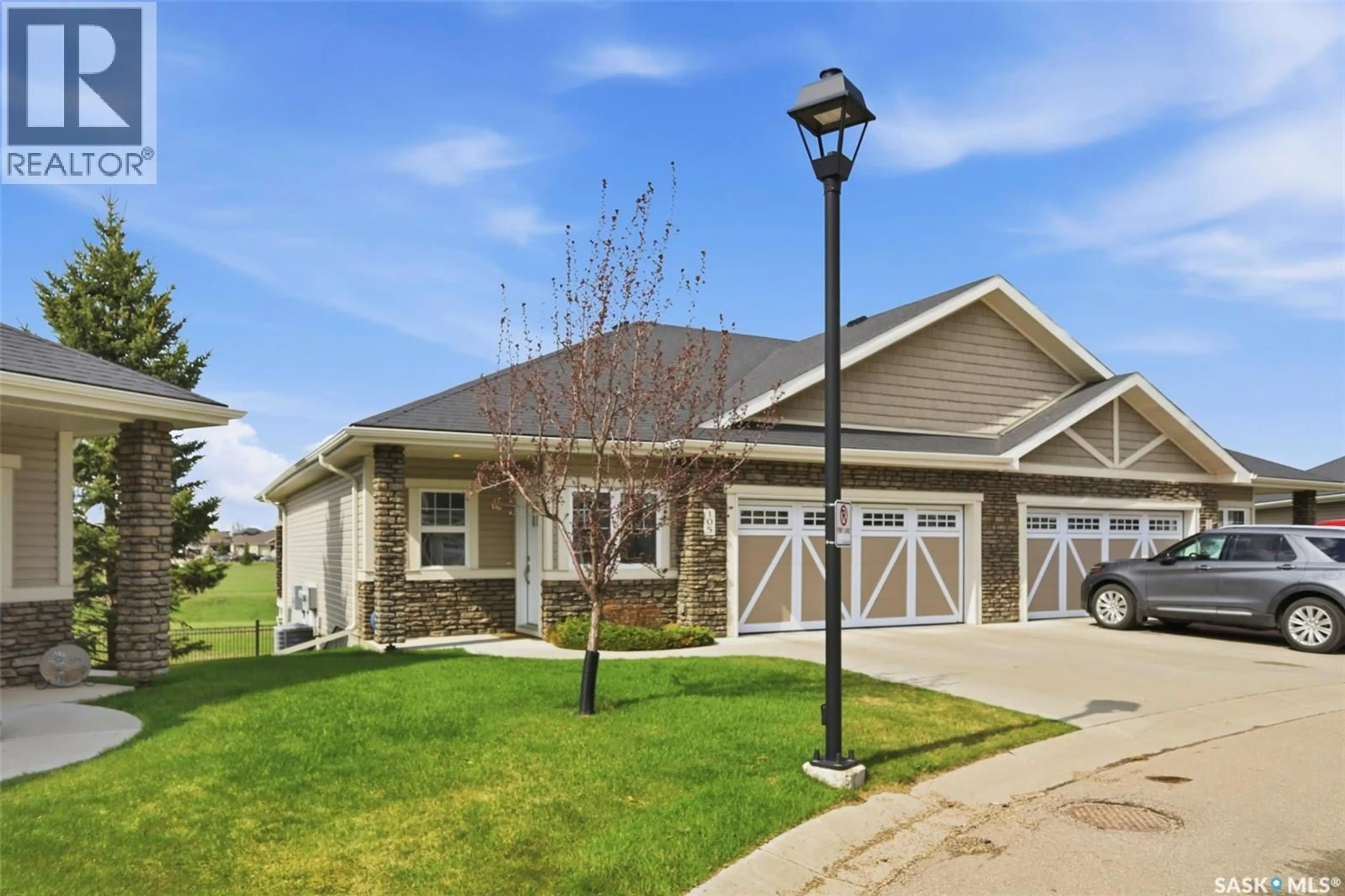 Home with vinyl exterior material, street for 105 - 542 PRINGLE CRESCENT, Saskatoon Saskatchewan S7T0W9