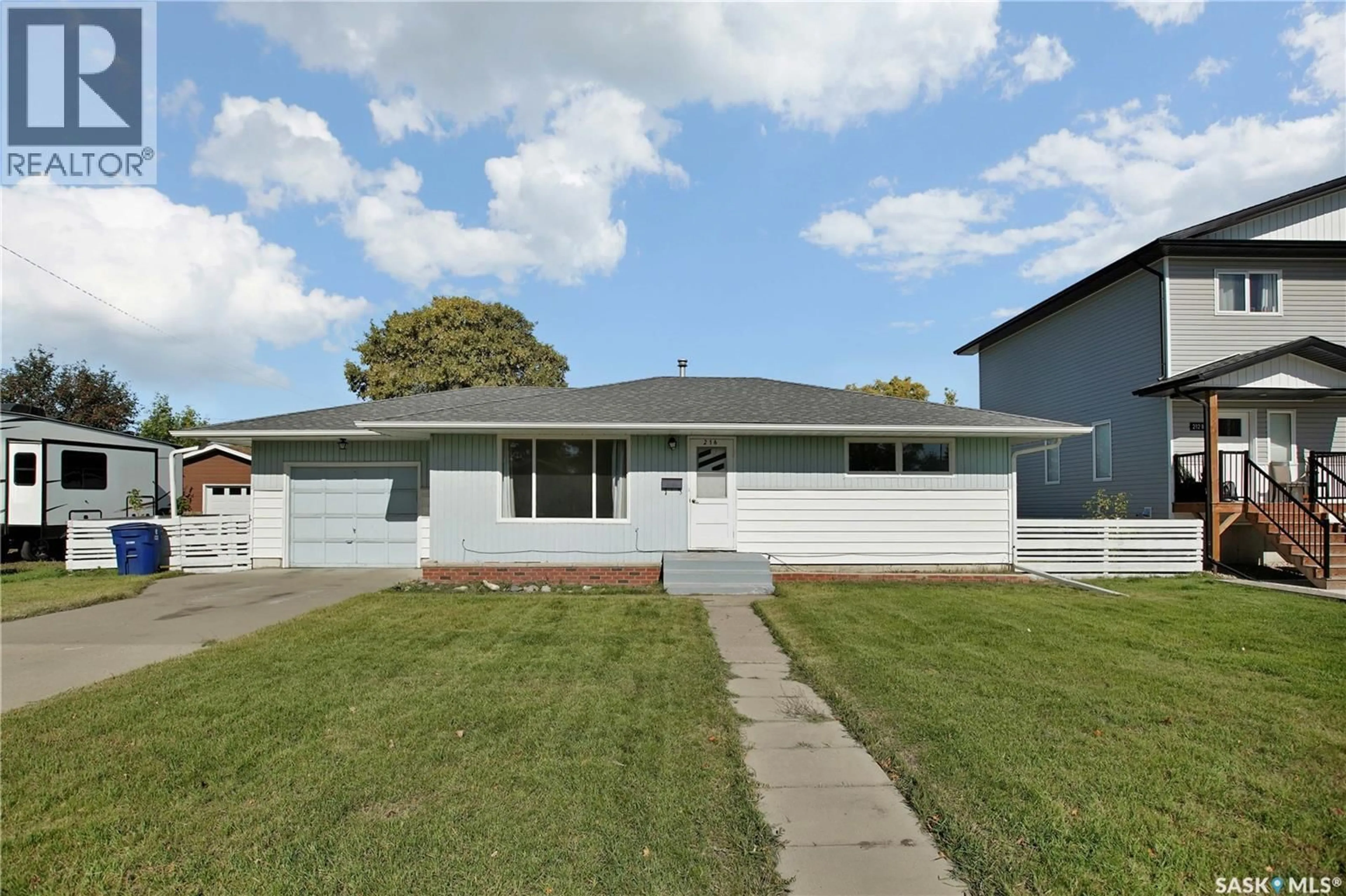Home with vinyl exterior material, street for 216 MAIN STREET, Warman Saskatchewan S0K4S0