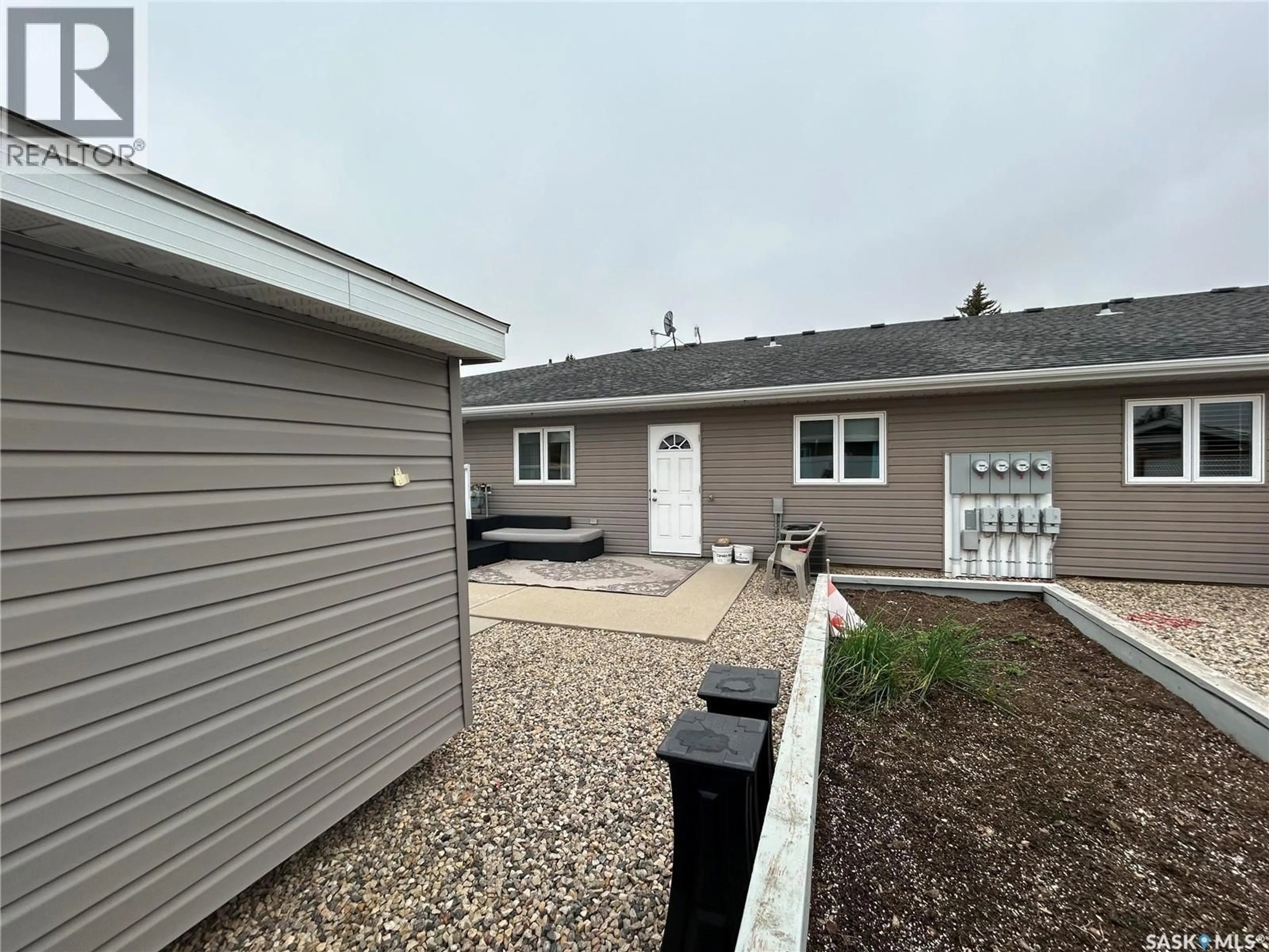 Home with vinyl exterior material, street for 1100B 95TH STREET, Tisdale Saskatchewan S0E1T0
