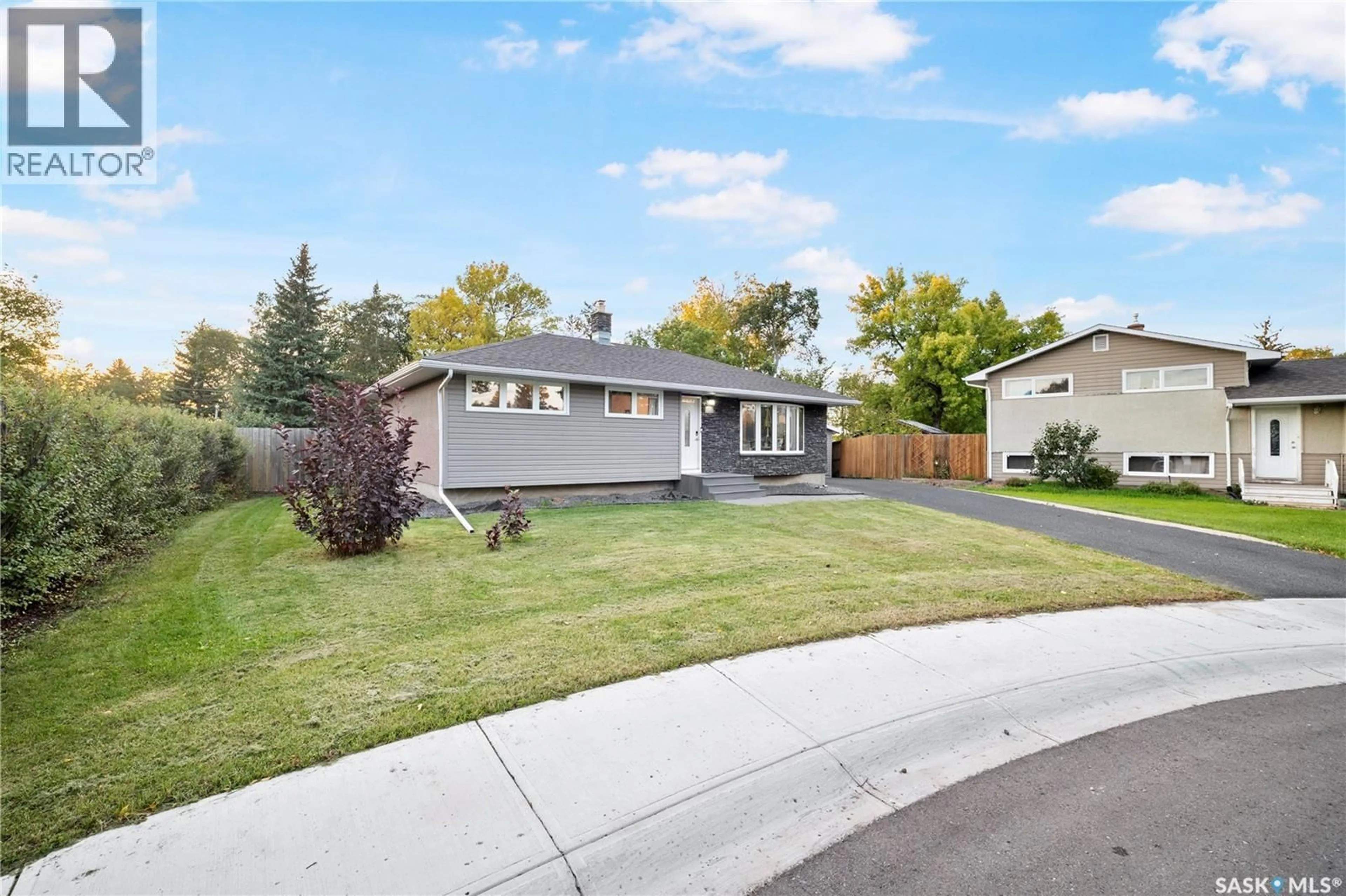Home with vinyl exterior material, street for 16 LIPTON PLACE, Regina Saskatchewan S4R3T6