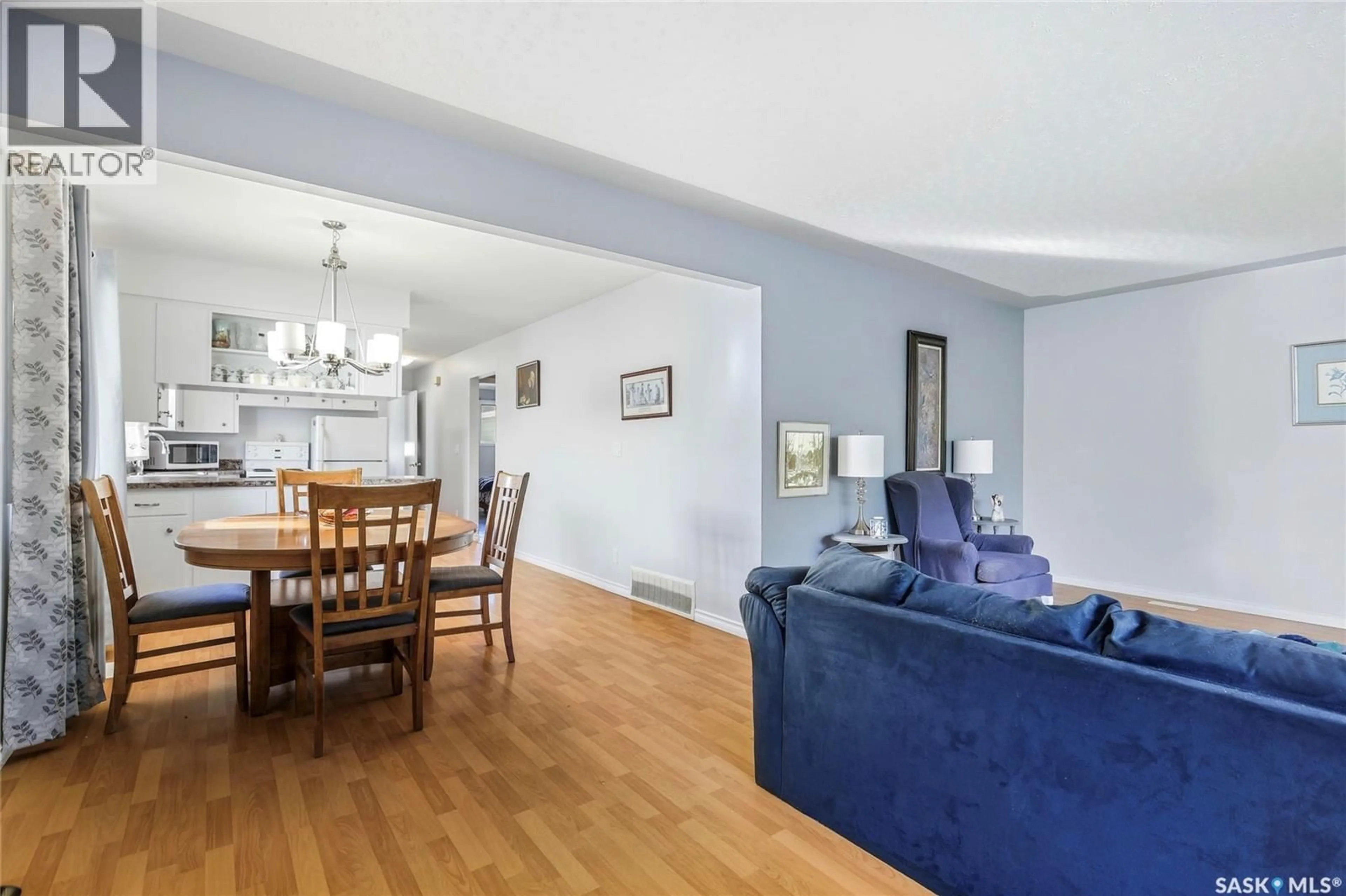 Living room with furniture, wood/laminate floor for 135 BROADWAY AVENUE, Regina Saskatchewan S4N1B2