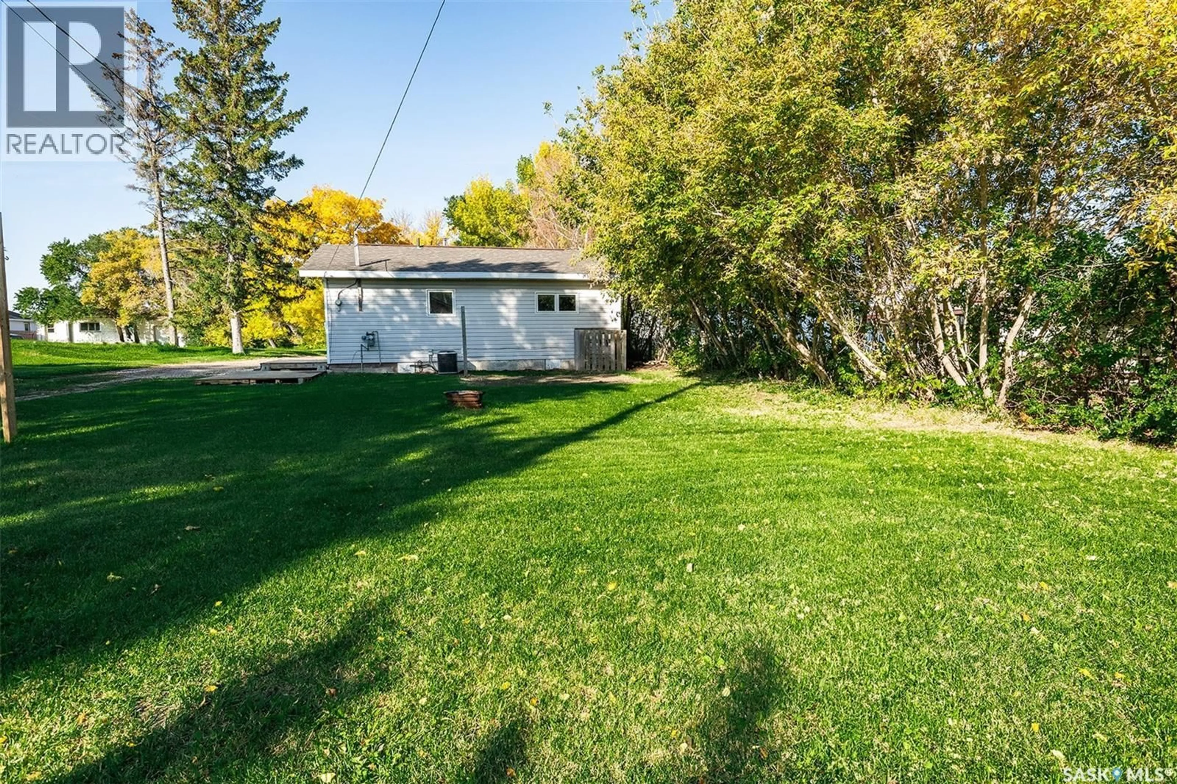 A pic from outside/outdoor area/front of a property/back of a property/a pic from drone, street for E - 212 5TH STREET, Wynyard Saskatchewan S0A4T0
