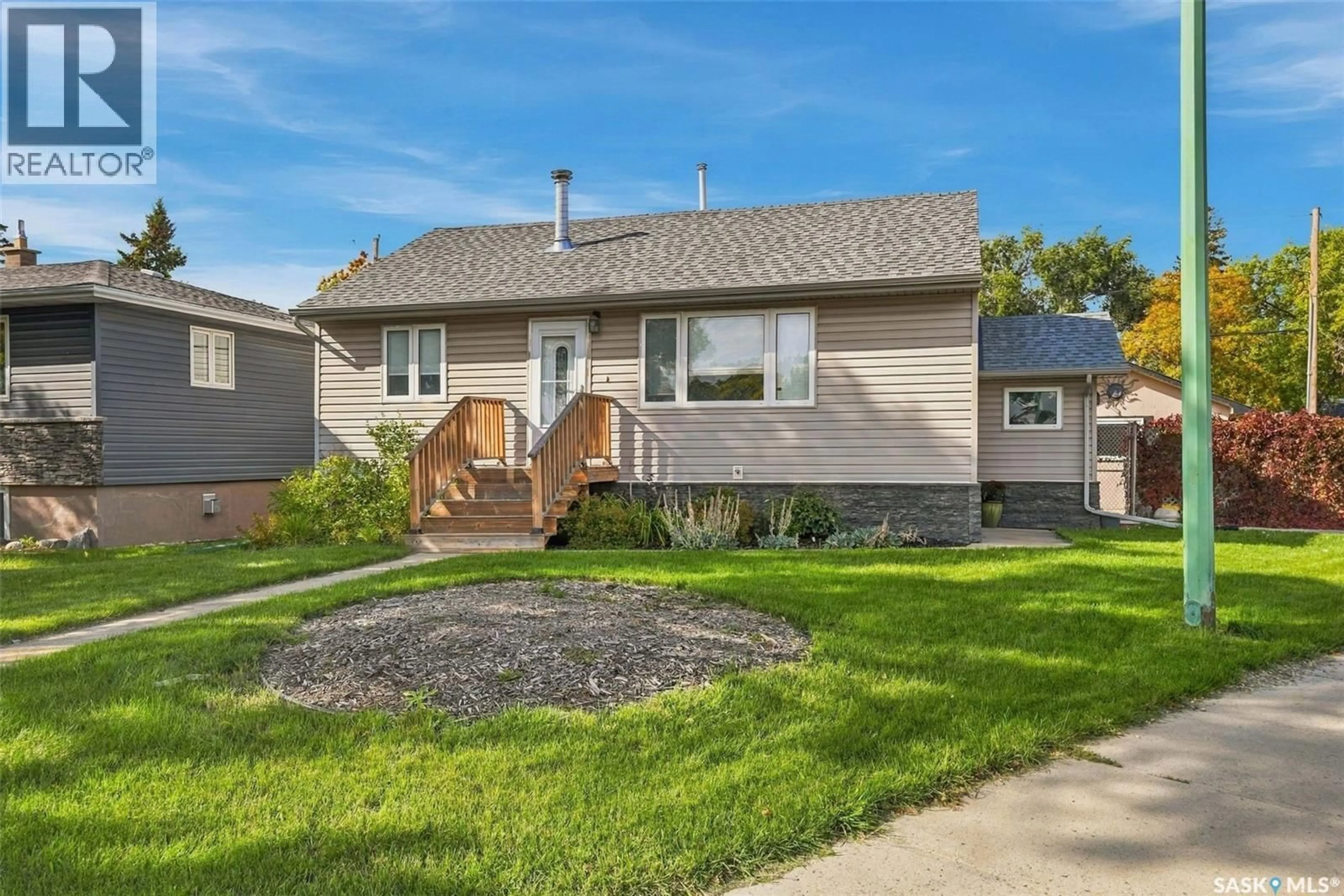 Home with vinyl exterior material, street for E - 600 MULLIN AVENUE, Regina Saskatchewan S4N1C9