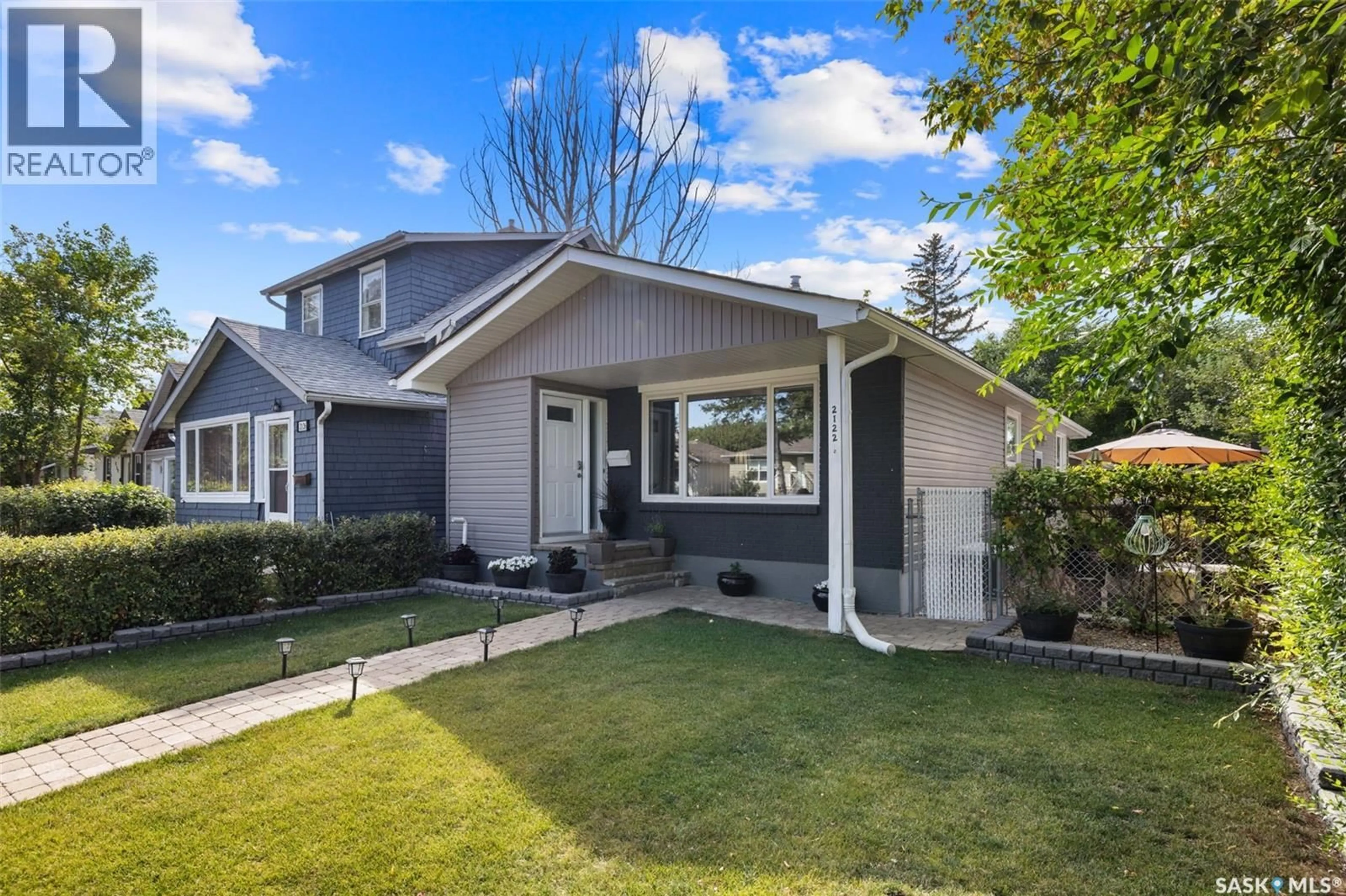 Home with vinyl exterior material, street for 2122 WASCANA STREET, Regina Saskatchewan S4T4J9