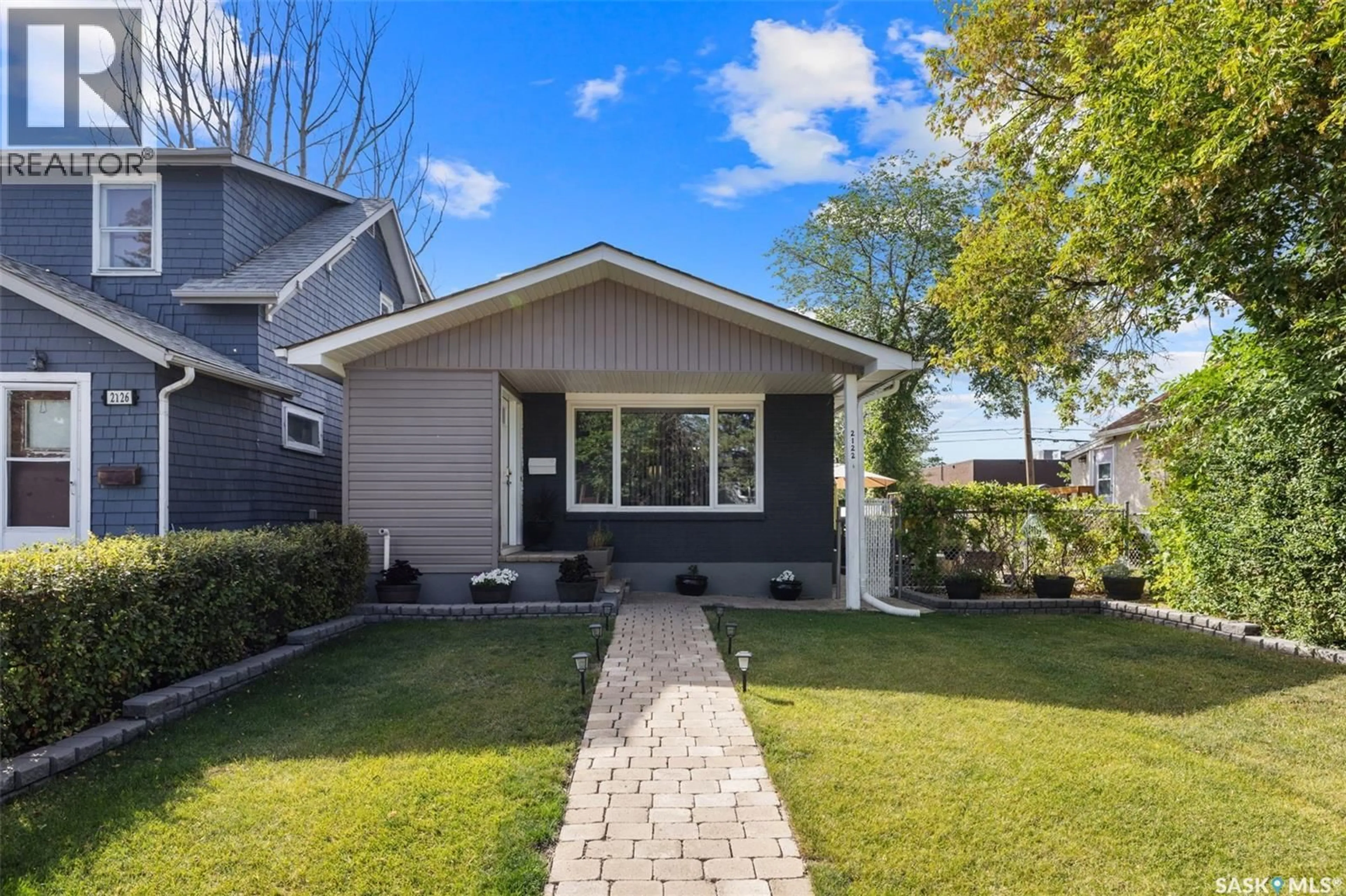 Home with vinyl exterior material, street for 2122 WASCANA STREET, Regina Saskatchewan S4T4J9