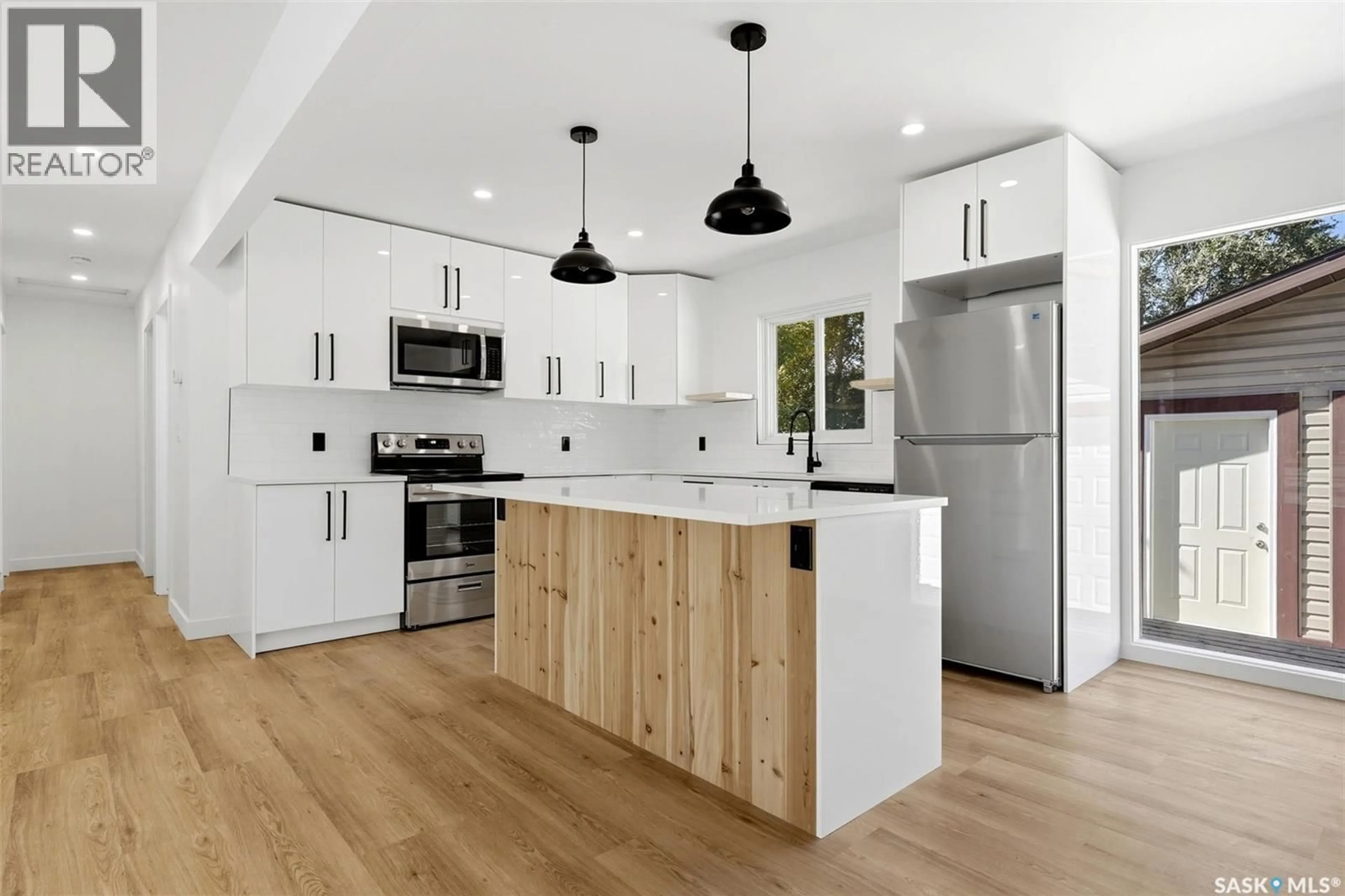 Open concept kitchen, wood/laminate floor for 3312 GRANT ROAD, Regina Saskatchewan S4S5H5