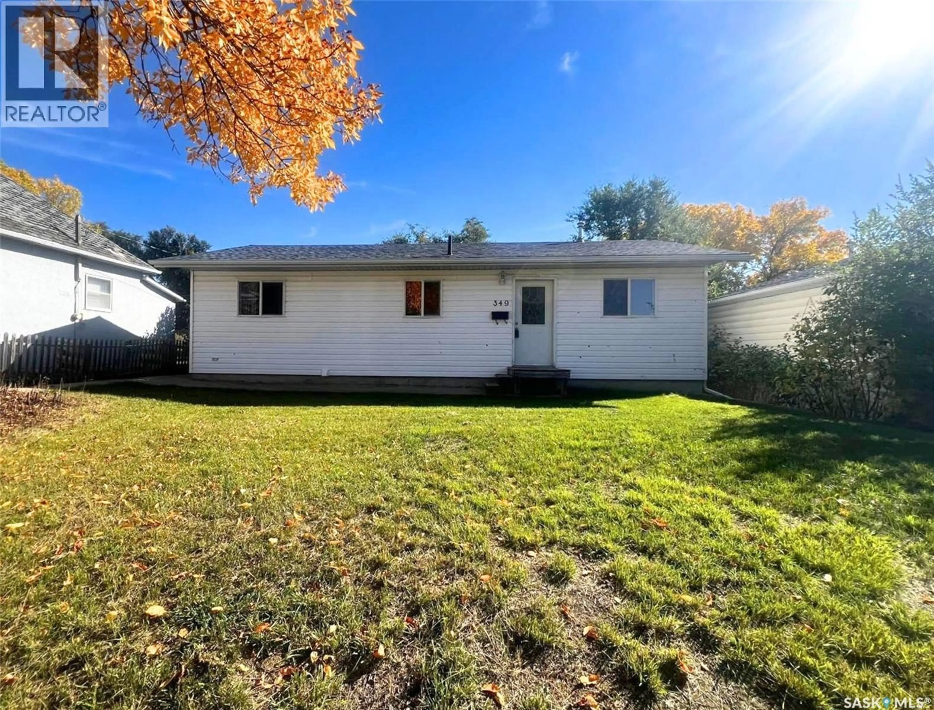 Home with vinyl exterior material, street for 349 10TH AVENUE, Swift Current Saskatchewan S9H1P1
