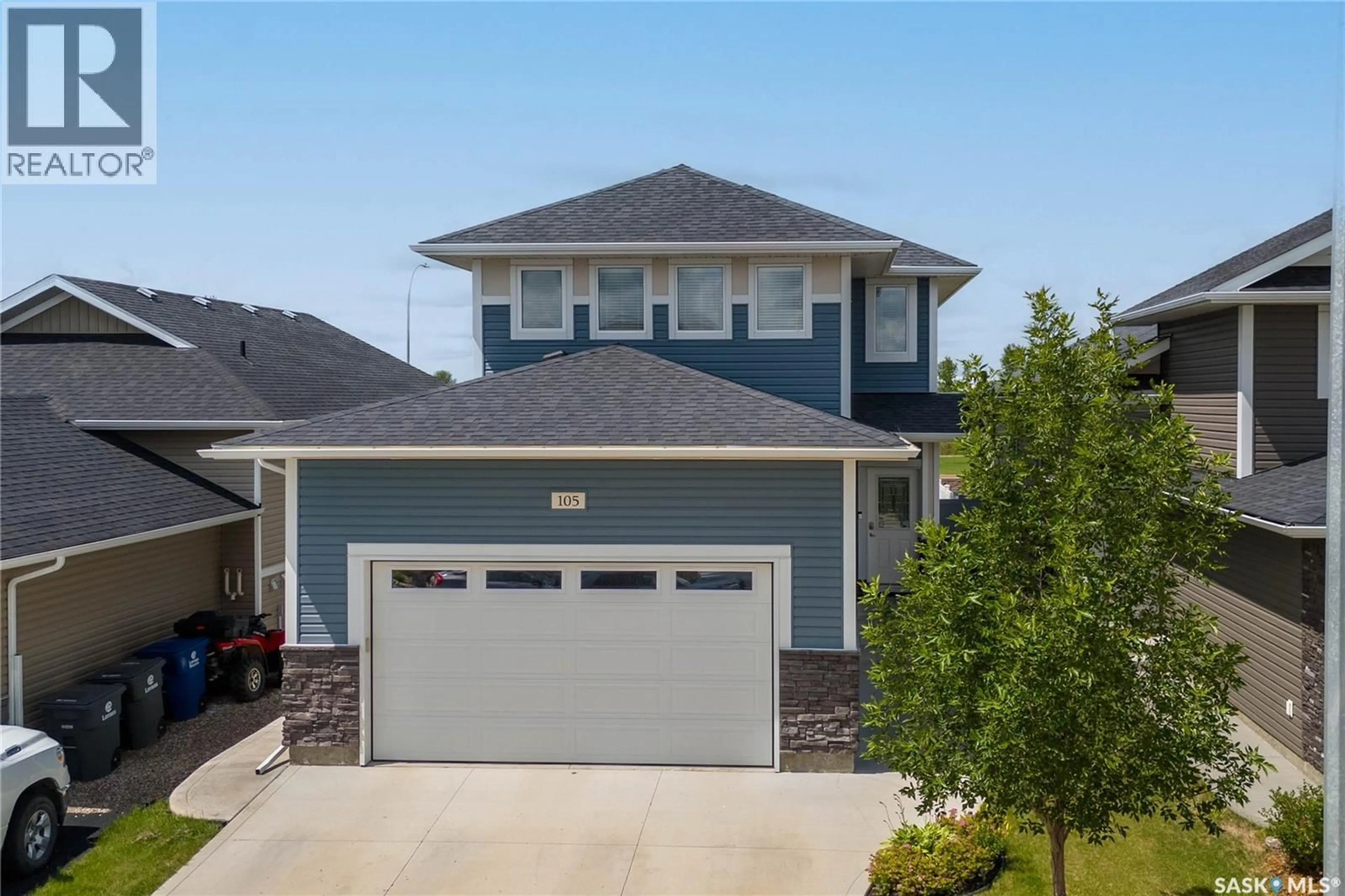 Home with vinyl exterior material, street for 105 COWAN CRESCENT, Martensville Saskatchewan S0K2T1