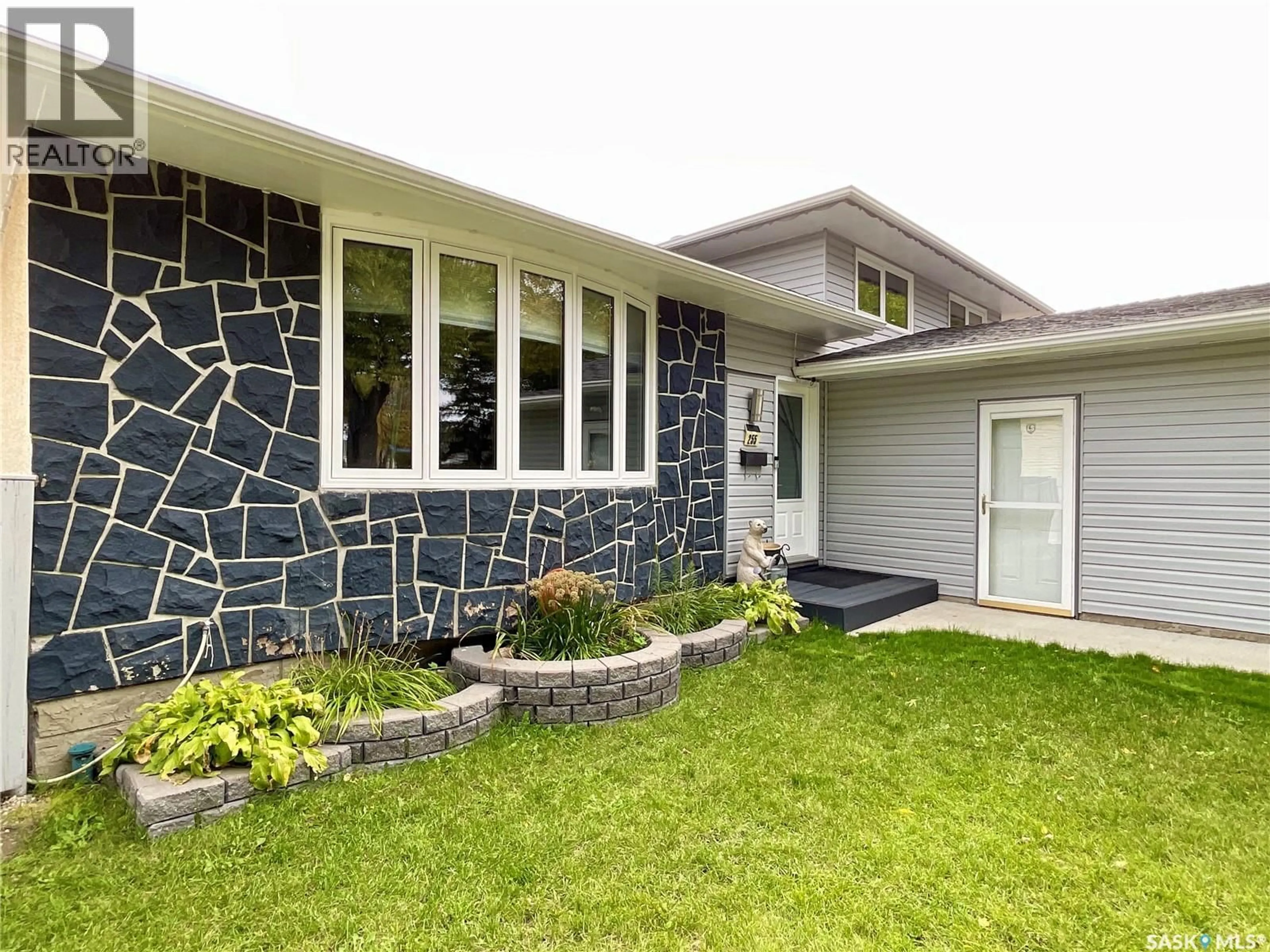 Home with vinyl exterior material, street for 255 LITZENBERGER CRESCENT, Regina Saskatchewan S4R7A2