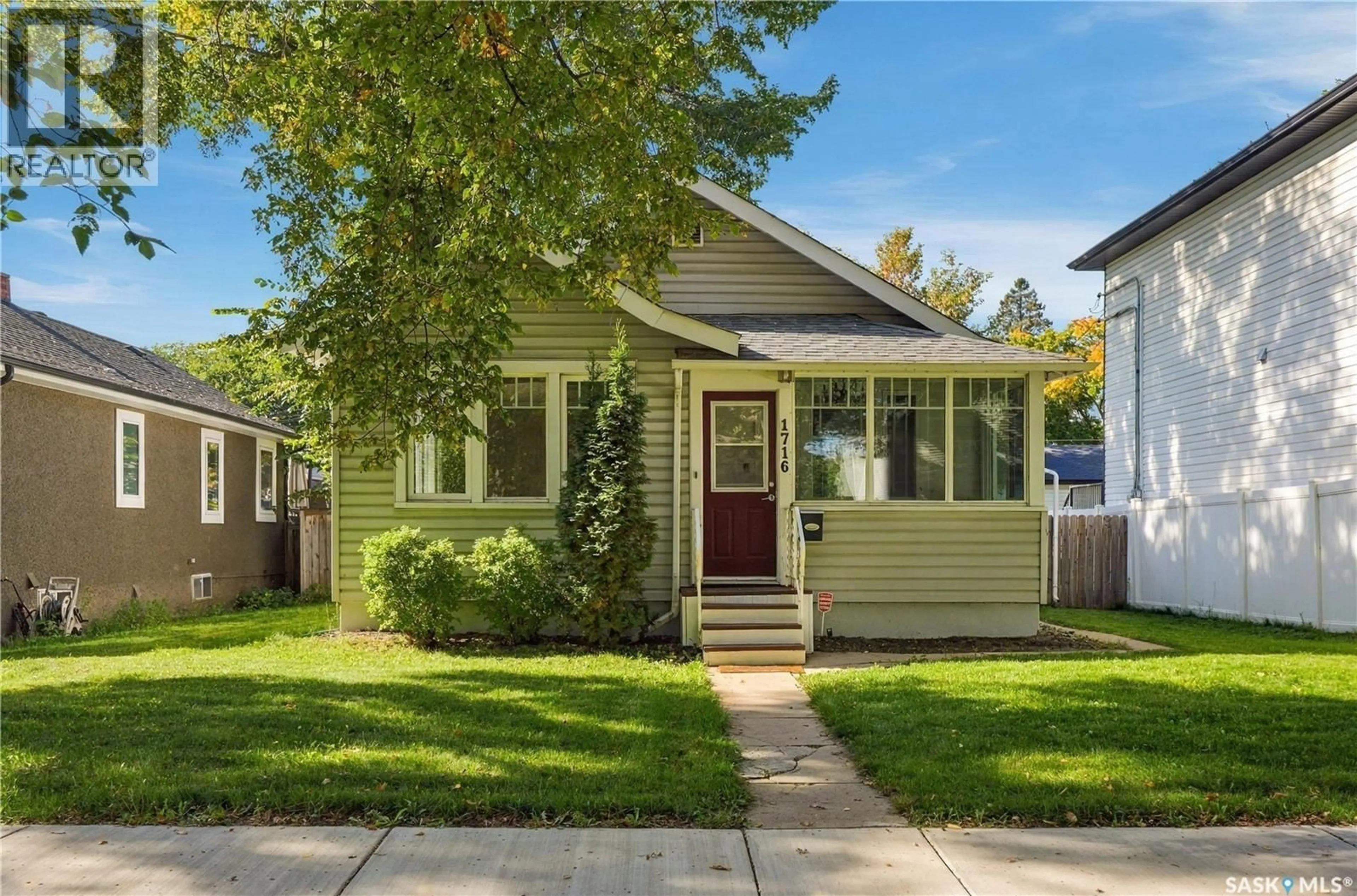 Home with vinyl exterior material, street for 1716 LORNE AVENUE, Saskatoon Saskatchewan S7H1Y4