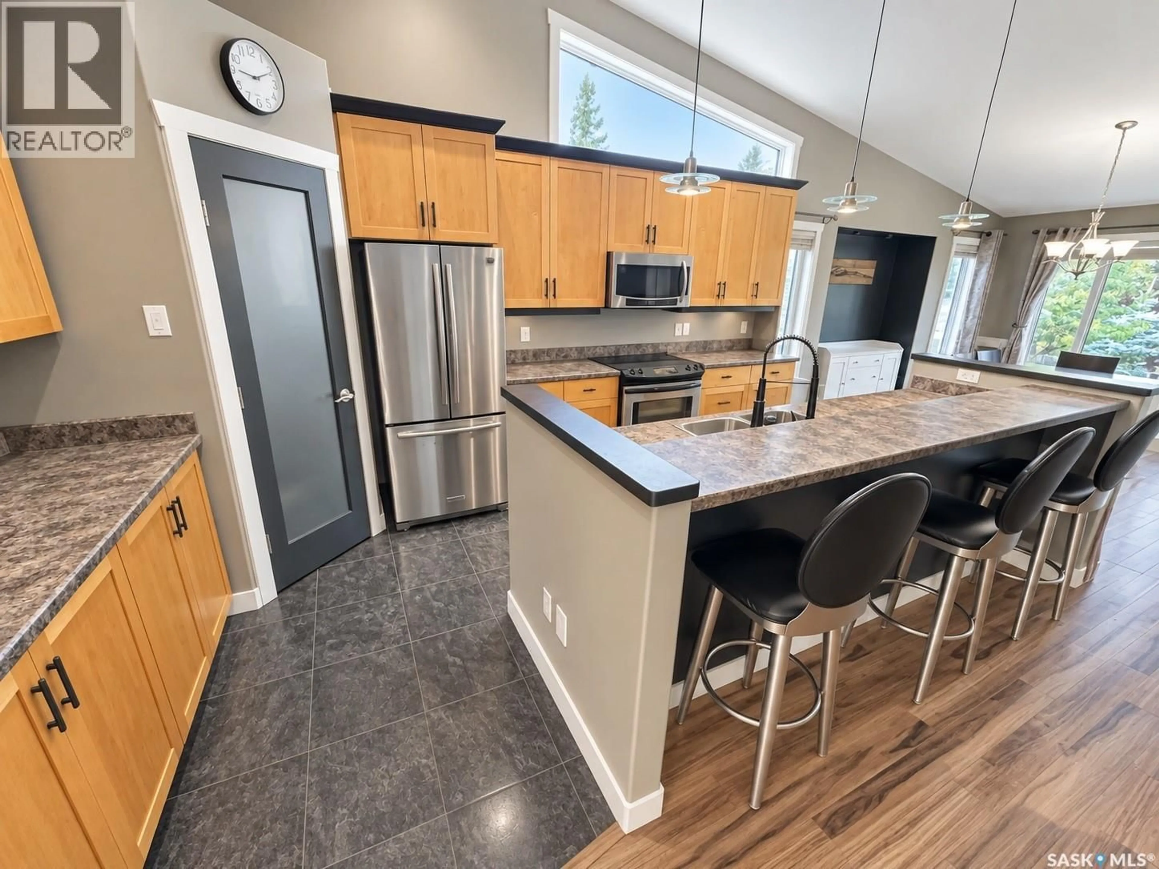 Open concept kitchen, ceramic/tile floor for 715 18TH STREET, Weyburn Saskatchewan S4H3M2